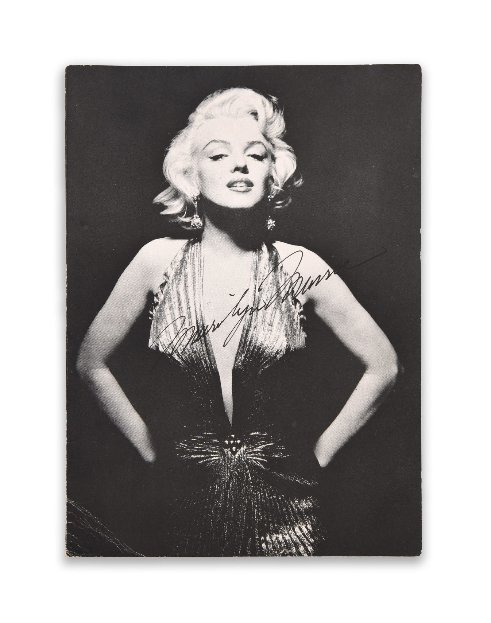 MARILYN MONROE (1926–1962), SIGNED PHOTOGRAPH POSTCARD, CIRCA 1950S–EARLY 1960S: MARILYN MONROE (1926–1962), SIGNED PHOTOGRAPH POSTCARD, CIRCA 1950S–EARLY 1960SProvenance and Authenticity:This item includes a certificate of authenticity. This black-and-white glamour portrait