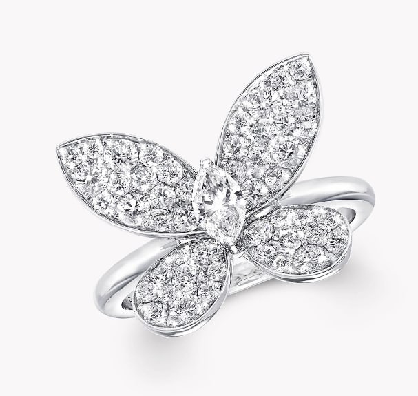 A LINGERING BUTTERFLY DIAMOND RING: A LINGERING BUTTERFLY DIAMOND RING Description: The mini curling butterfly diamond ring features a dazzling pave diamond paired with a magnificent marquise-shaped diamond. The three-dimensional butter