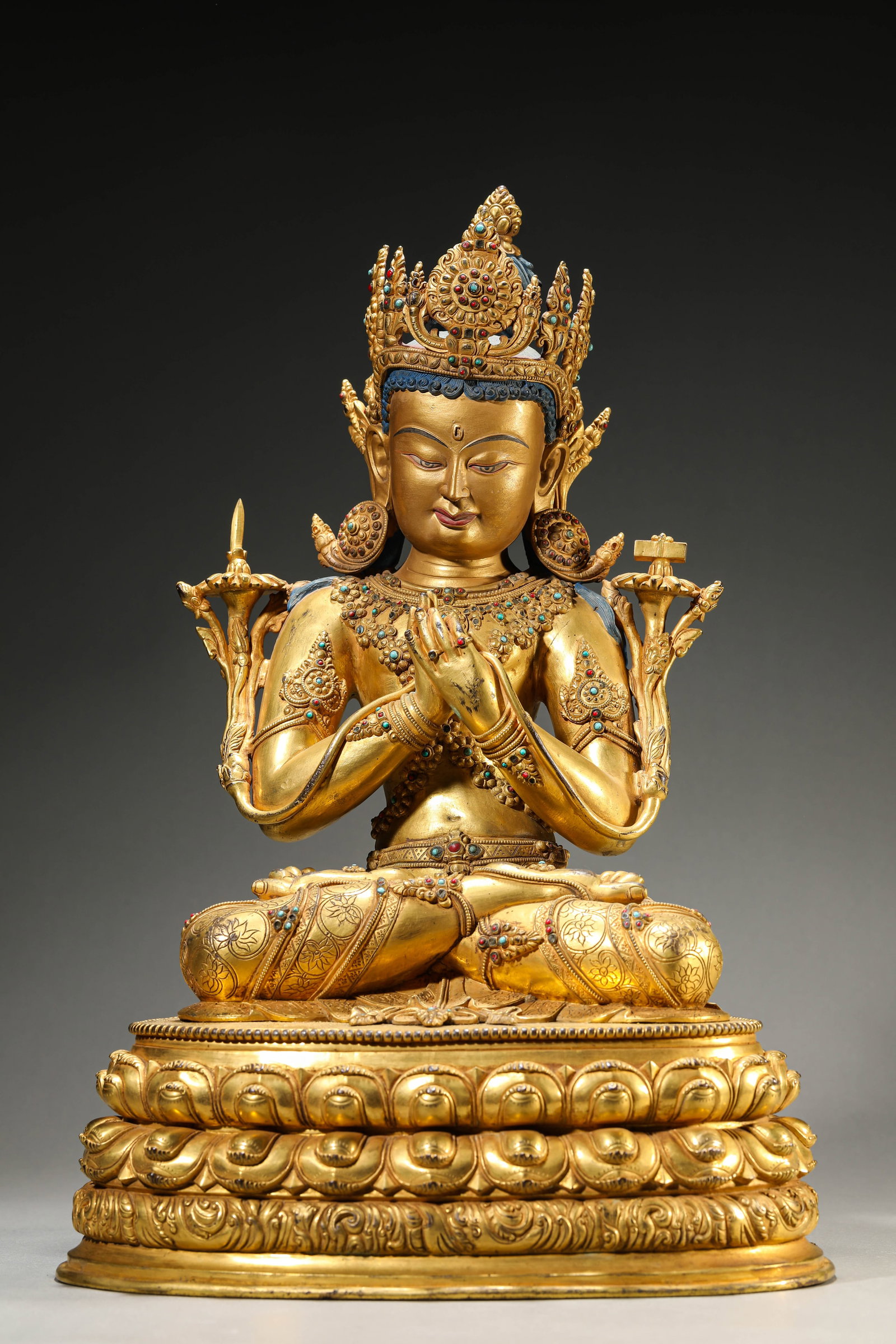 A GILT-BRONZE FIGURE OF MANJUSHRI: A GILT-BRONZE FIGURE OF MANJUSHRI Dimensions: Weight: 11kg. Length: 29.5 cm (11.61 in) x Width: 22.5 cm (8.86 in) x Height: 45.0 cm (17.72 in). All measurements are approximate.