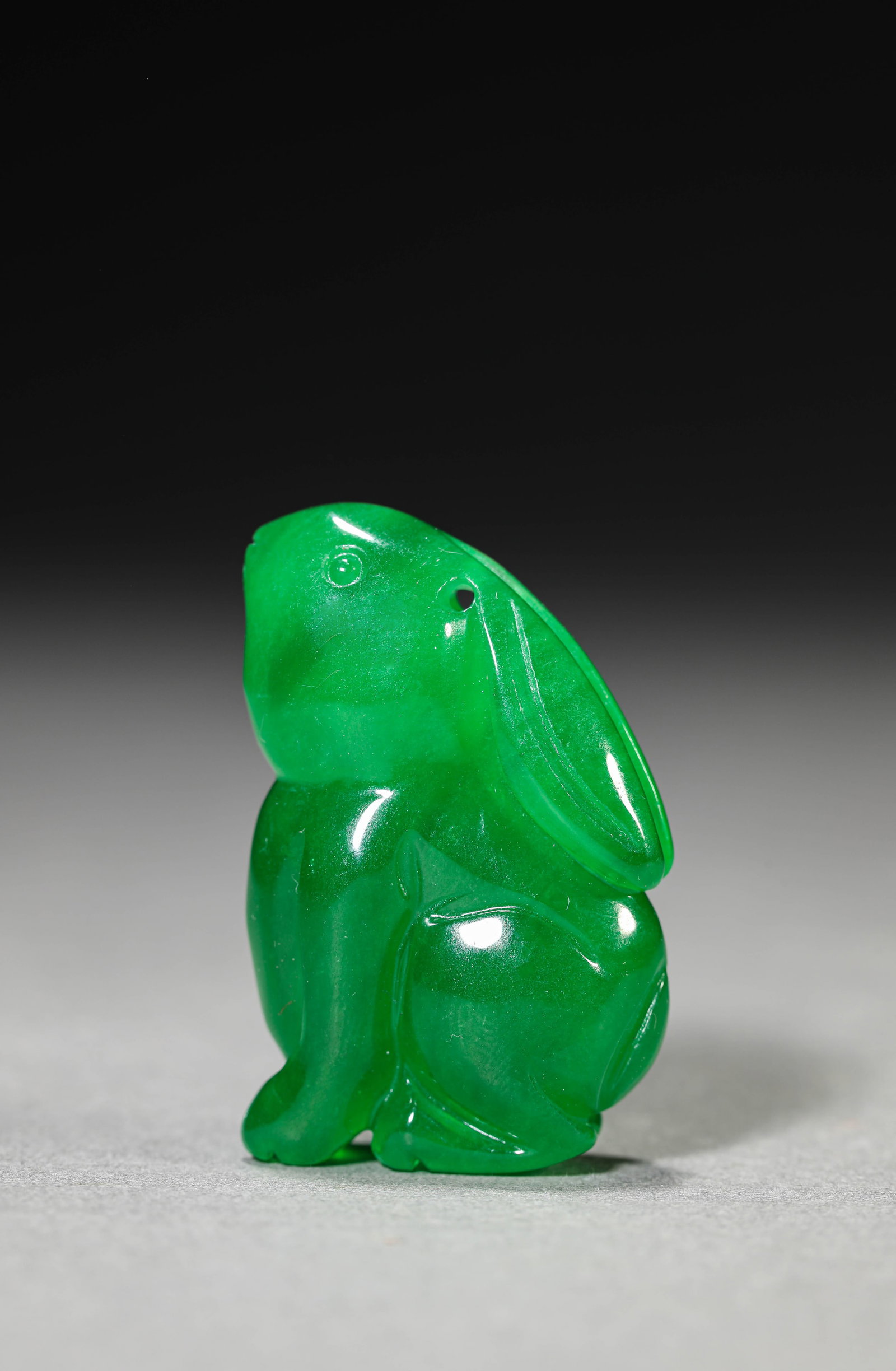 A JADEITE RABBIT: A JADEITE RABBIT Dimensions: Length: 2.6 cm (1.02 in) x Width: 1.5 cm (0.59 in) x Height: 4.0 cm (1.57 in). All measurements are approximate.