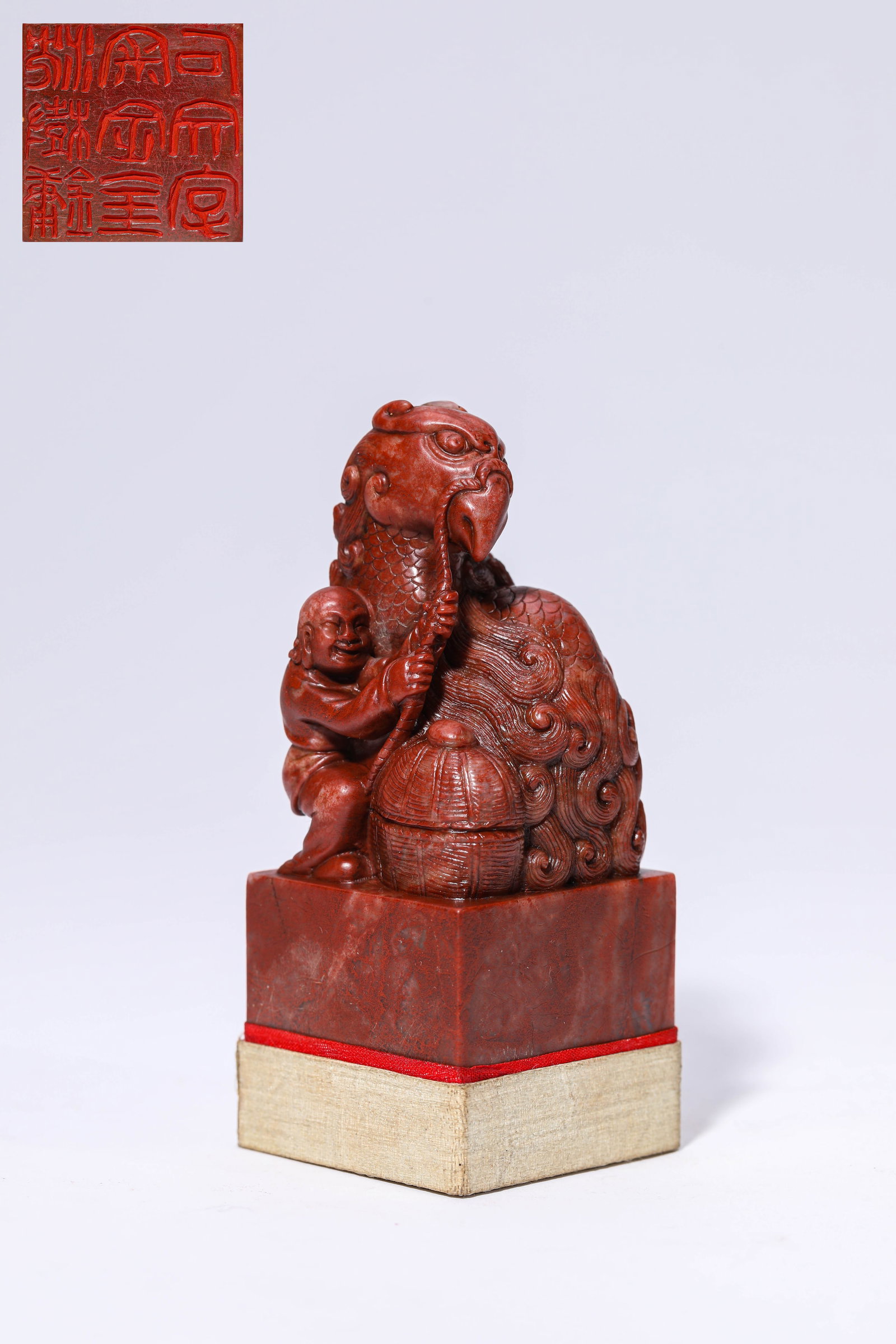 A 'CHICKEN-BLOOD' STONE SEAL: A 'CHICKEN-BLOOD' STONE SEAL Dimensions: Width: 3.9 cm (1.54 in) x Height: 9.5 cm (3.74 in). All measurements are approximate.