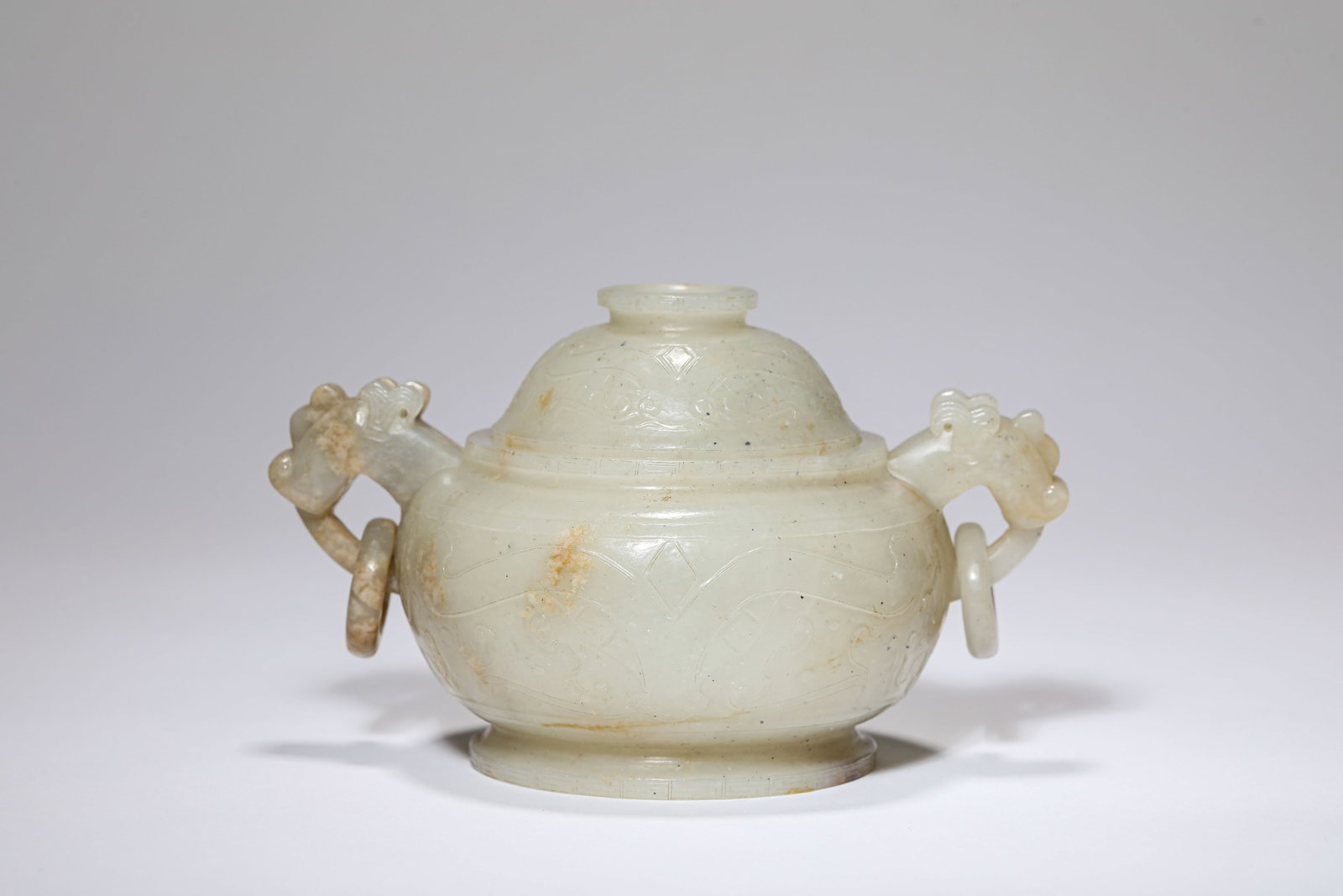 A JADE 'ANIMAL MASK' CENSER: A JADE 'ANIMAL MASK' CENSER Dimensions: Length: 13.9 cm (5.47 in) x Width: 9.5 cm (3.74 in) x Height: 8.2 cm (3.23 in). All measurements are approximate.