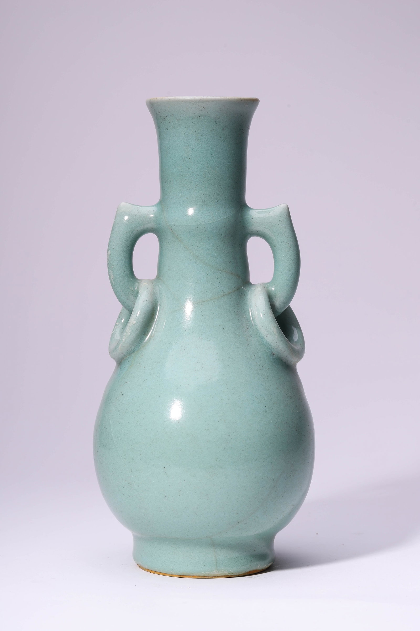 A LONGQUAN-TYPE 'DOUBLE RING HANDLES' VASE: A LONGQUAN-TYPE 'DOUBLE RING HANDLES' VASE Dimensions: Width: 12.8 cm (5.04 in) x Height: 26.9 cm (10.59 in). All measurements are approximate.