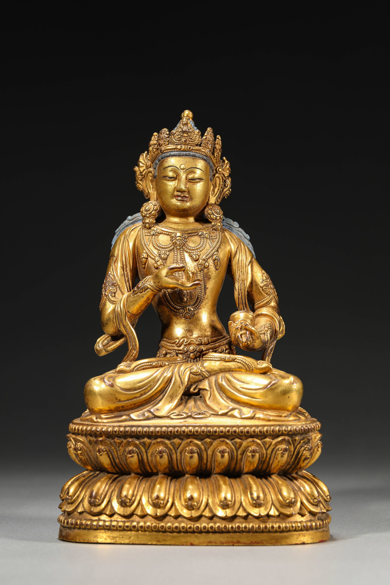 A GILT-BRONZE FIGURE OF VAJRASATTVA: A GILT-BRONZE FIGURE OF VAJRASATTVA Dimensions: Weight: 2273g. Length: 14.0 cm (5.51 in) x Width: 9.5 cm (3.74 in) x Height: 23.0 cm (9.06 in). All measurements are approximate.
