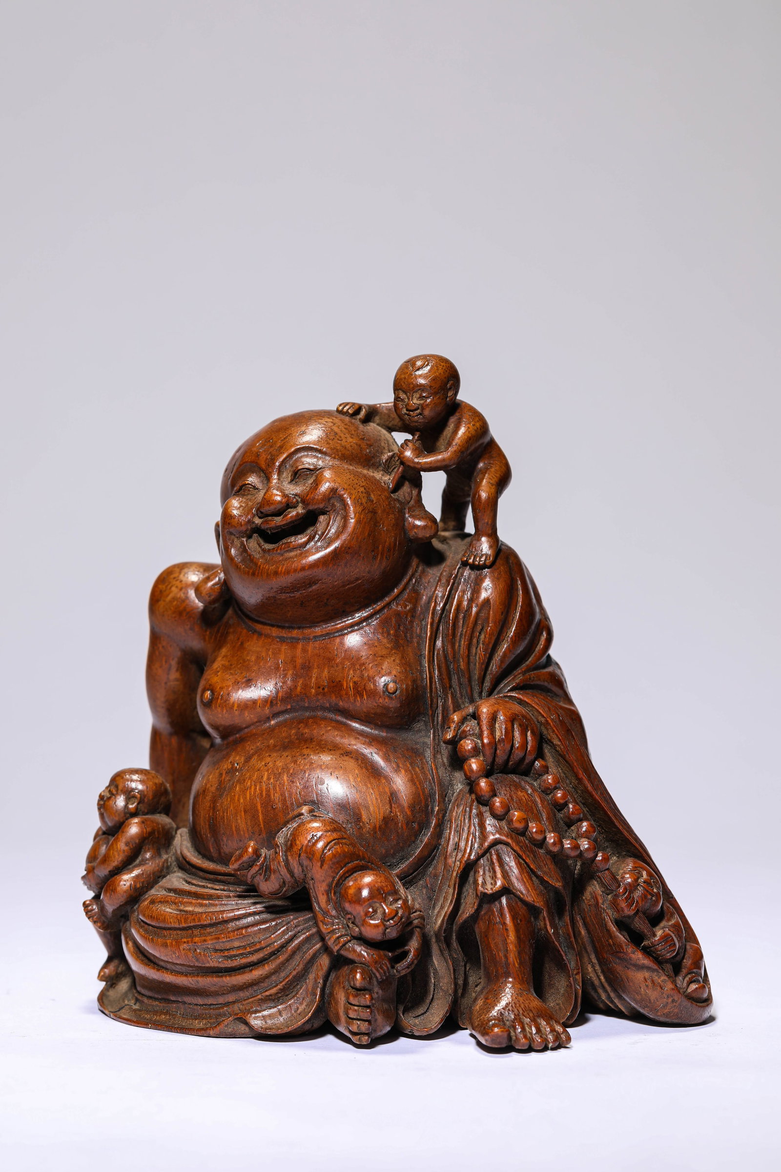 A BAMBOO 'CARVING OF FIVE SONS': A BAMBOO 'CARVING OF FIVE SONS' Dimensions: Length: 16.5 cm (6.50 in) x Width: 14.0 cm (5.51 in) x Height: 17.5 cm (6.89 in). All measurements are approximate.