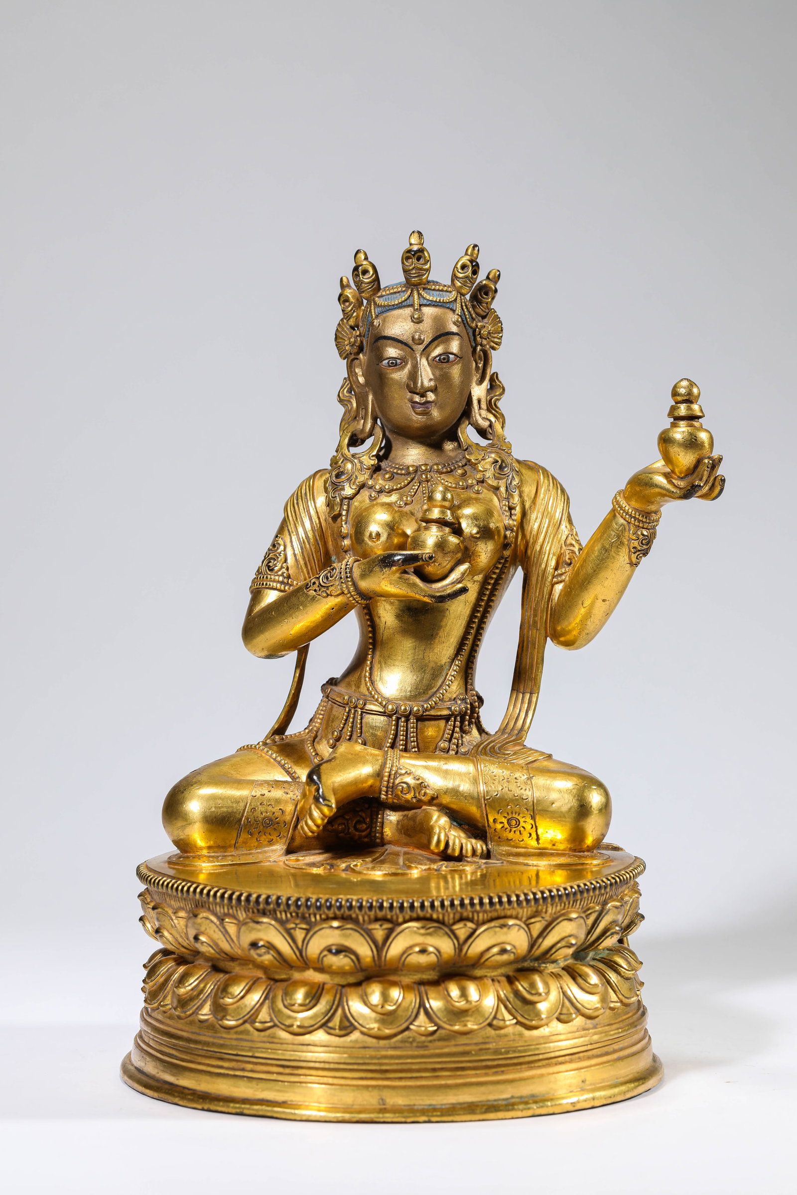 A GILT-BRONZE FIGURE OF BUDDHA (1 of 7)