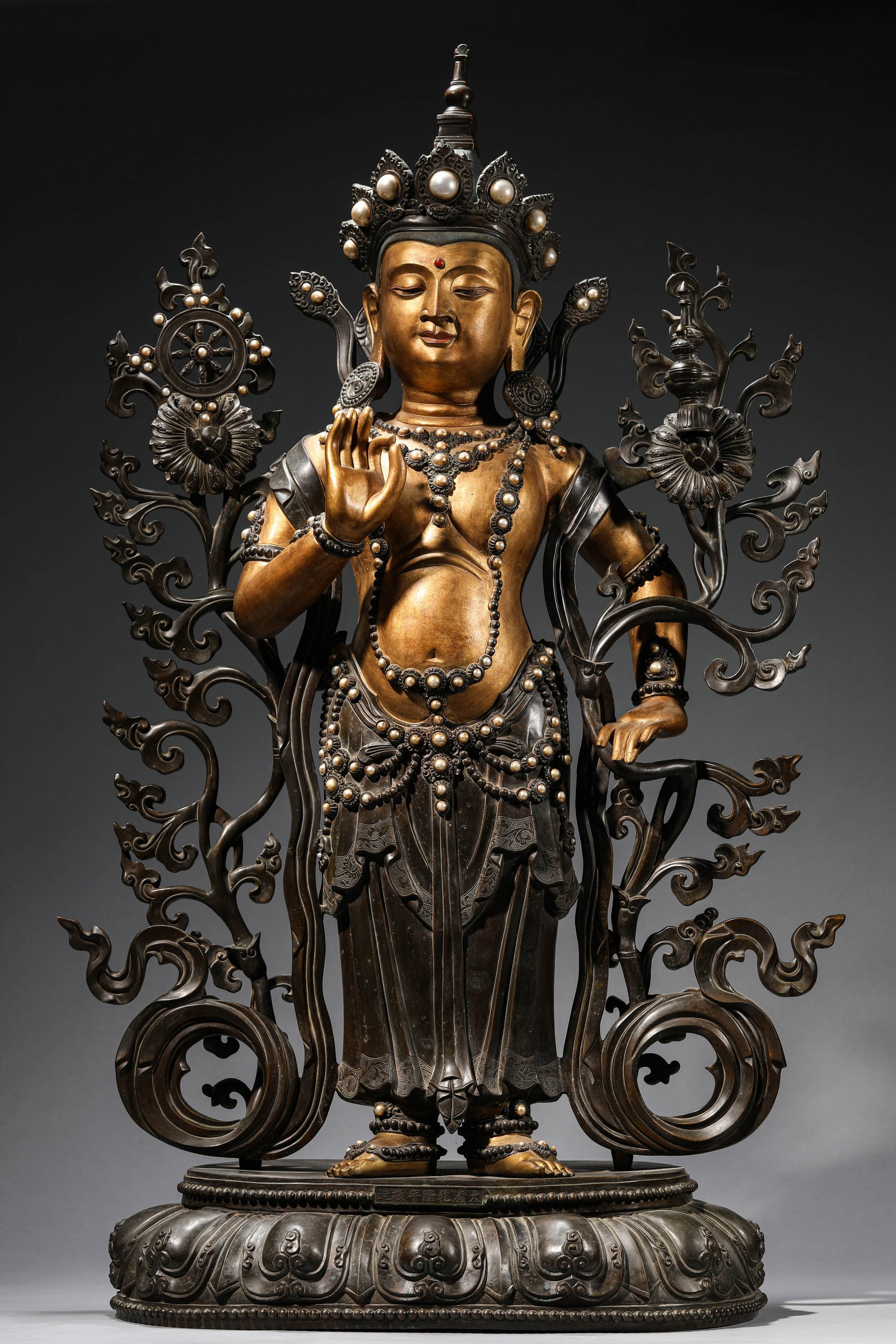 A LACQUERED AND GILT-BRONZE FIGURE OF PADMAPANI: A LACQUERED AND GILT-BRONZE FIGURE OF PADMAPANI Dimensions: Weight: 38.75kg. Length: 50.5 cm (19.88 in) x Width: 32.5 cm (12.80 in) x Height: 91.0 cm (35.83 in). All measurements are approximate.