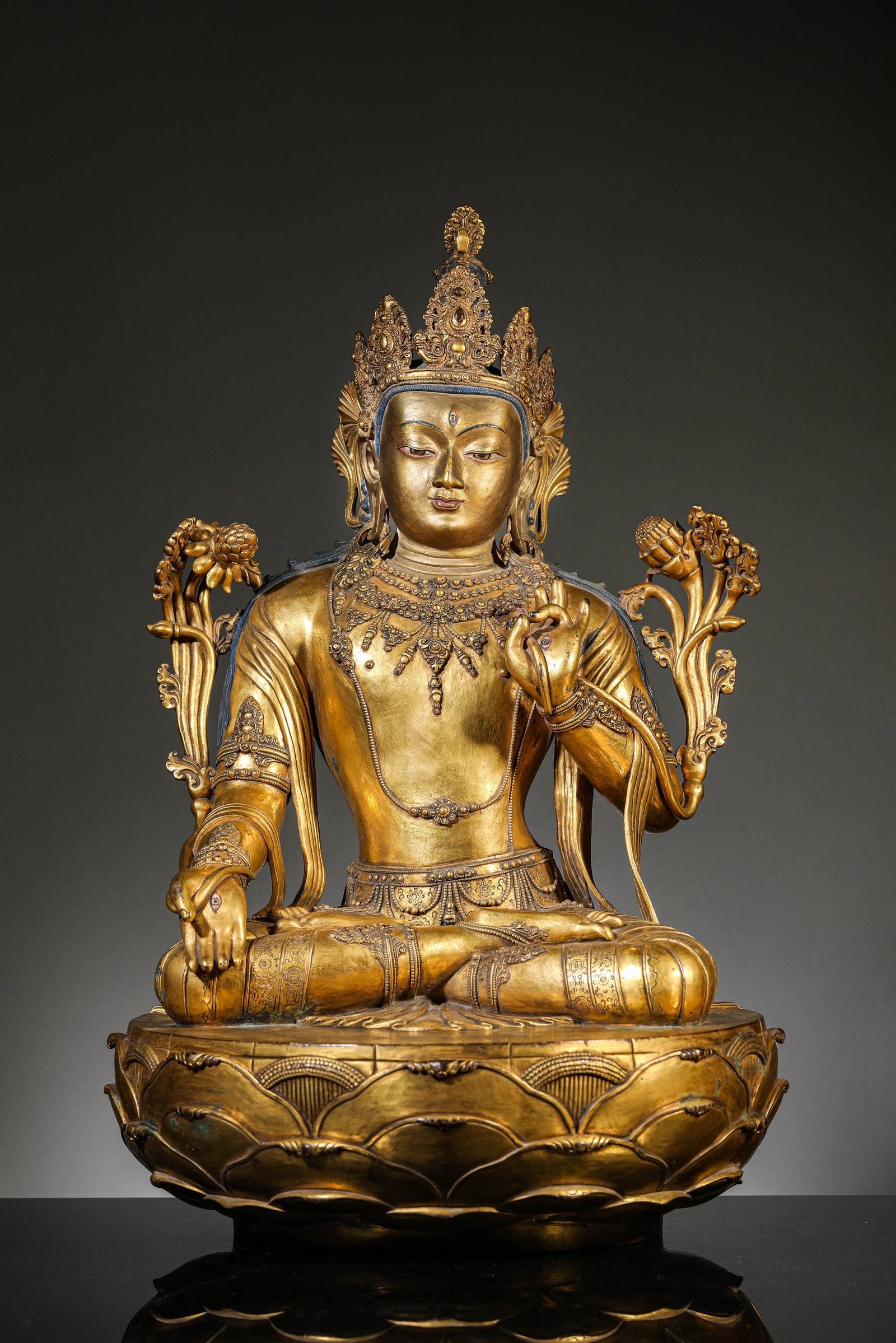 A GILT-BRONZE FIGURE OF WHITE TARA: A GILT-BRONZE FIGURE OF WHITE TARA Dimensions: Weight: 16.9kg. Width: 30.0 cm (11.81 in) x Height: 47.5 cm (18.70 in). All measurements are approximate.