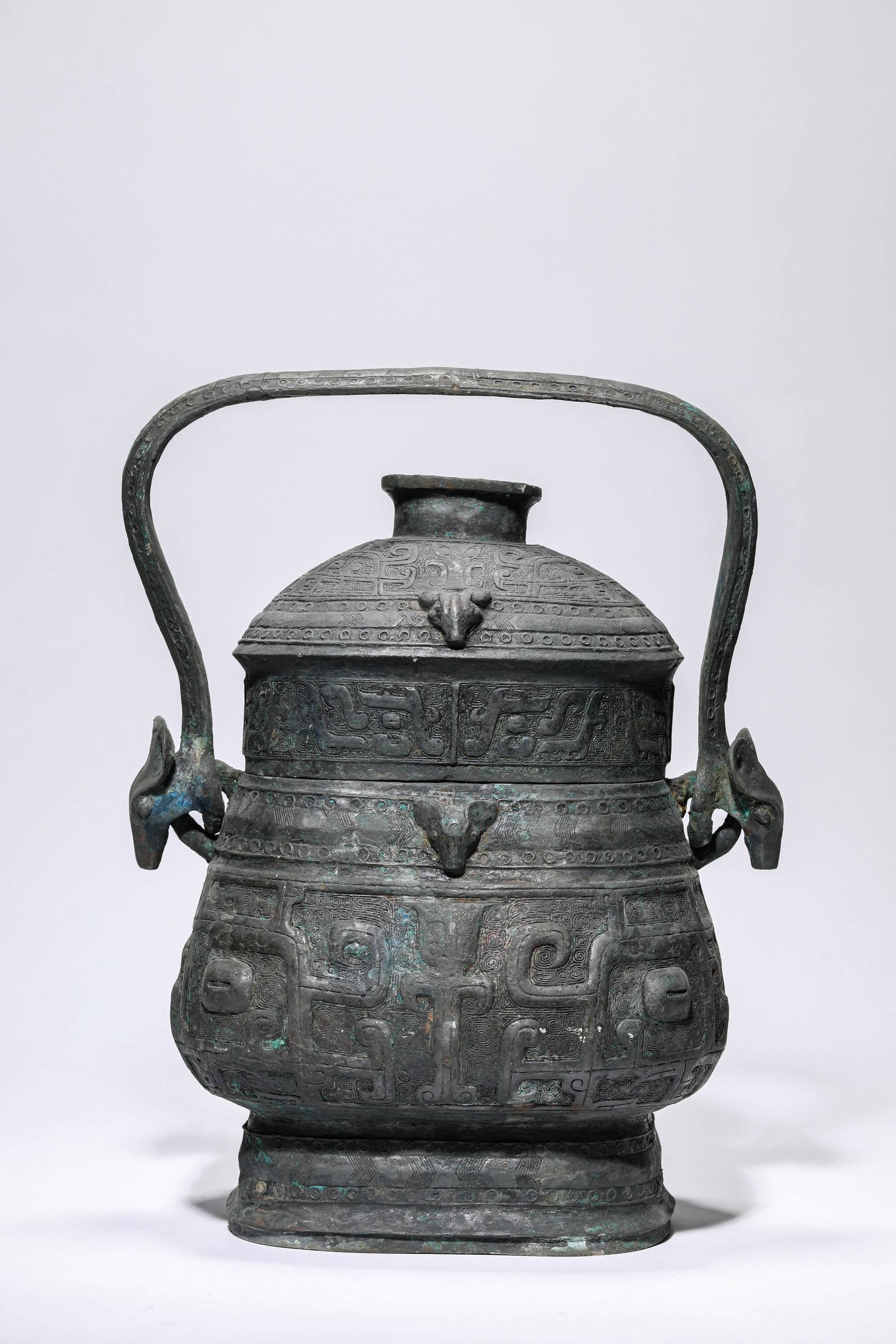A BRONZE 'TAOTIE' 'LOOP-HANDLED' YOU: A BRONZE 'TAOTIE' 'LOOP-HANDLED' YOU Dimensions: Weight: 6.4kg. Length: 25.7 cm (10.12 in) x Width: 17.6 cm (6.93 in) x Height: 34.7 cm (13.66 in). All measurements are approximate.