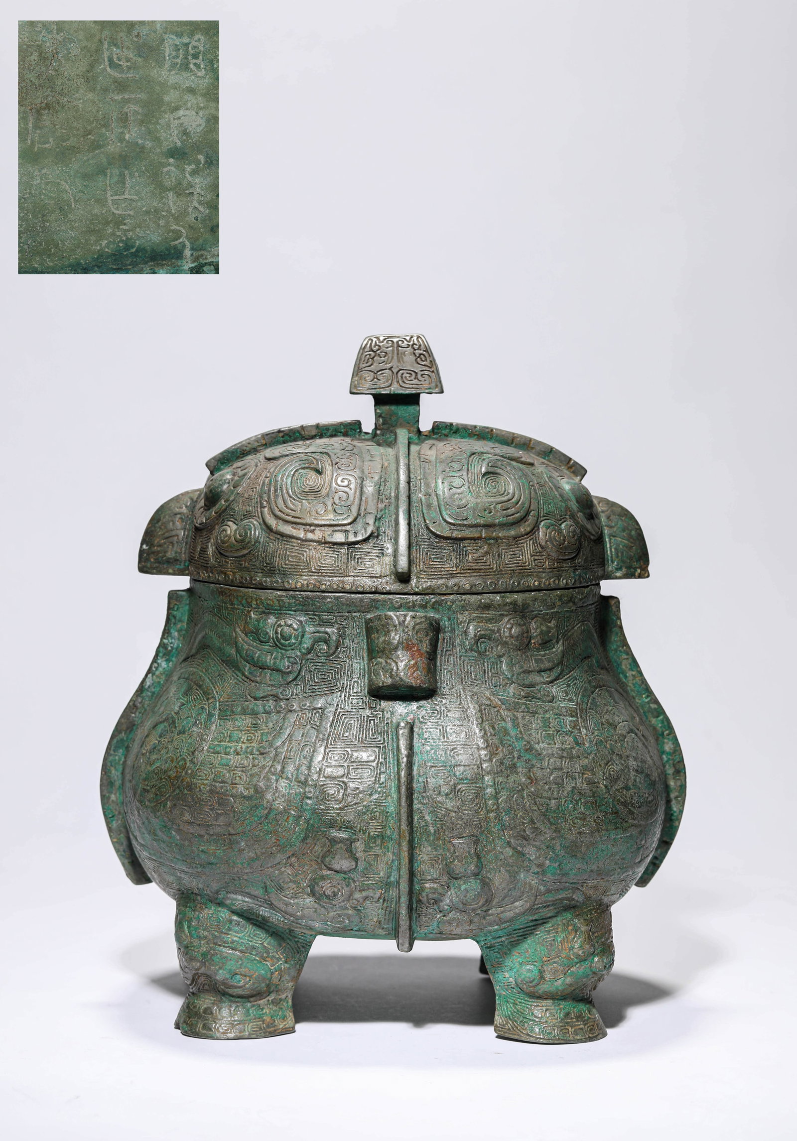 A BRONZE 'OWL-FORM' YOU: A BRONZE 'OWL-FORM' YOU Dimensions: Weight: 6.2kg. Length: 25.1 cm (9.88 in) x Width: 23.1 cm (9.09 in) x Height: 29.0 cm (11.42 in). All measurements are approximate.