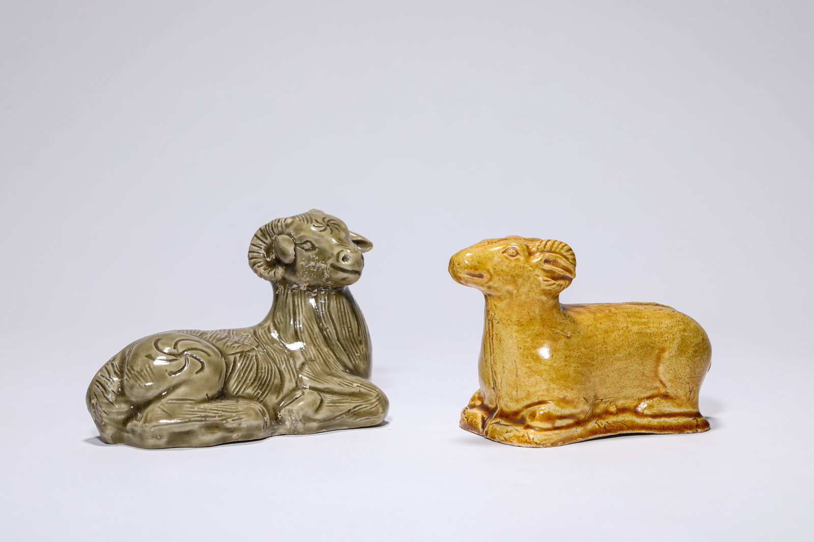 A GROUP OF PORCELAIN RAMS: A GROUP OF PORCELAIN RAMS Dimensions: Length: 11.3 cm (4.45 in) x Width: 5.5 cm (2.17 in) x Height: 7.3 cm (2.87 in).Length: 10.5 cm (4.13 in) x Width: 5.1 cm (2.01 in) x Height: 6.8 cm (2.68 in).