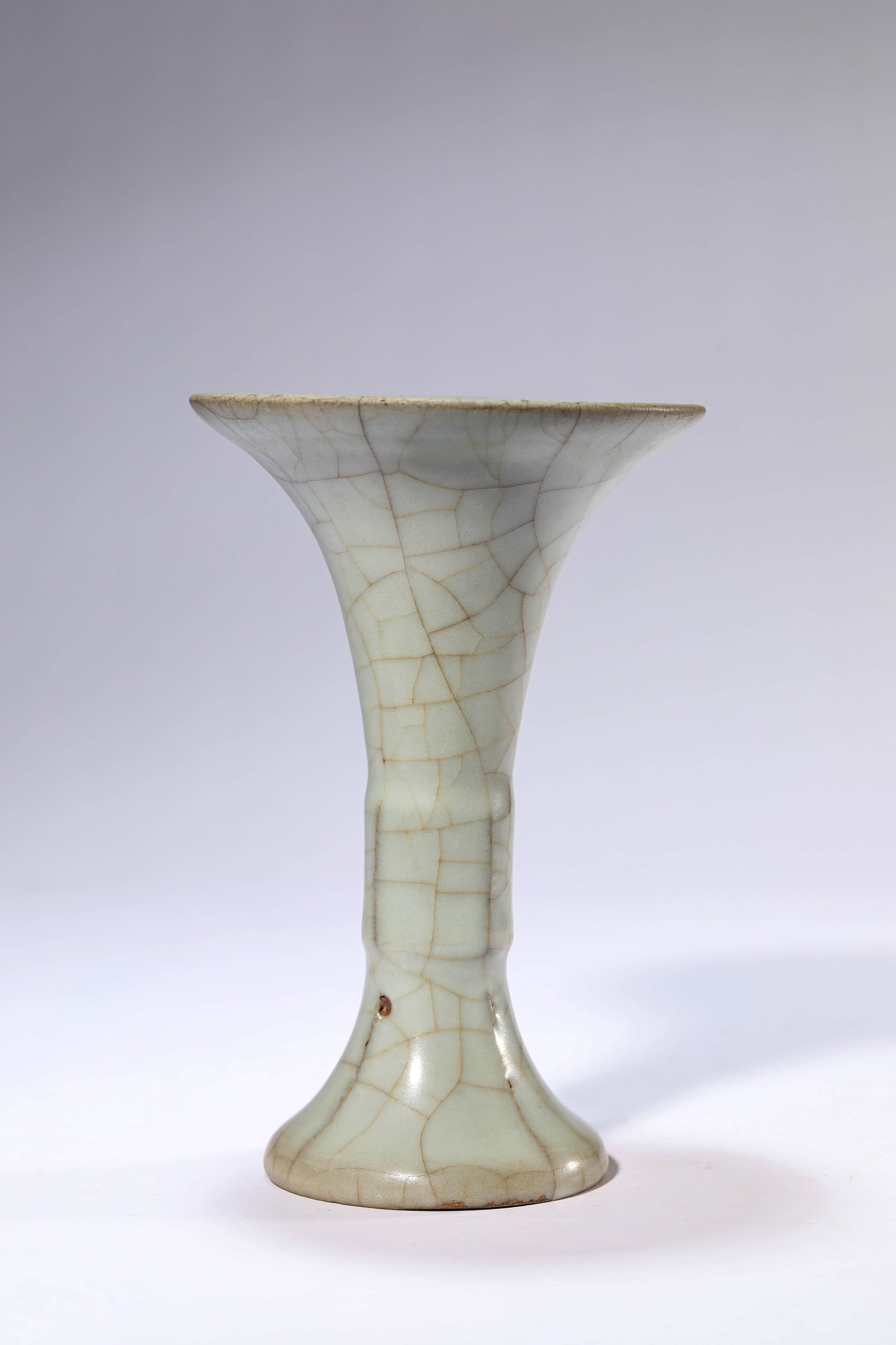 A GUAN-TYPE 'GU' BEAKER: A GUAN-TYPE 'GU' BEAKER Dimensions: Width: 11.2 cm (4.41 in) x Height: 17.1 cm (6.73 in). All measurements are approximate.