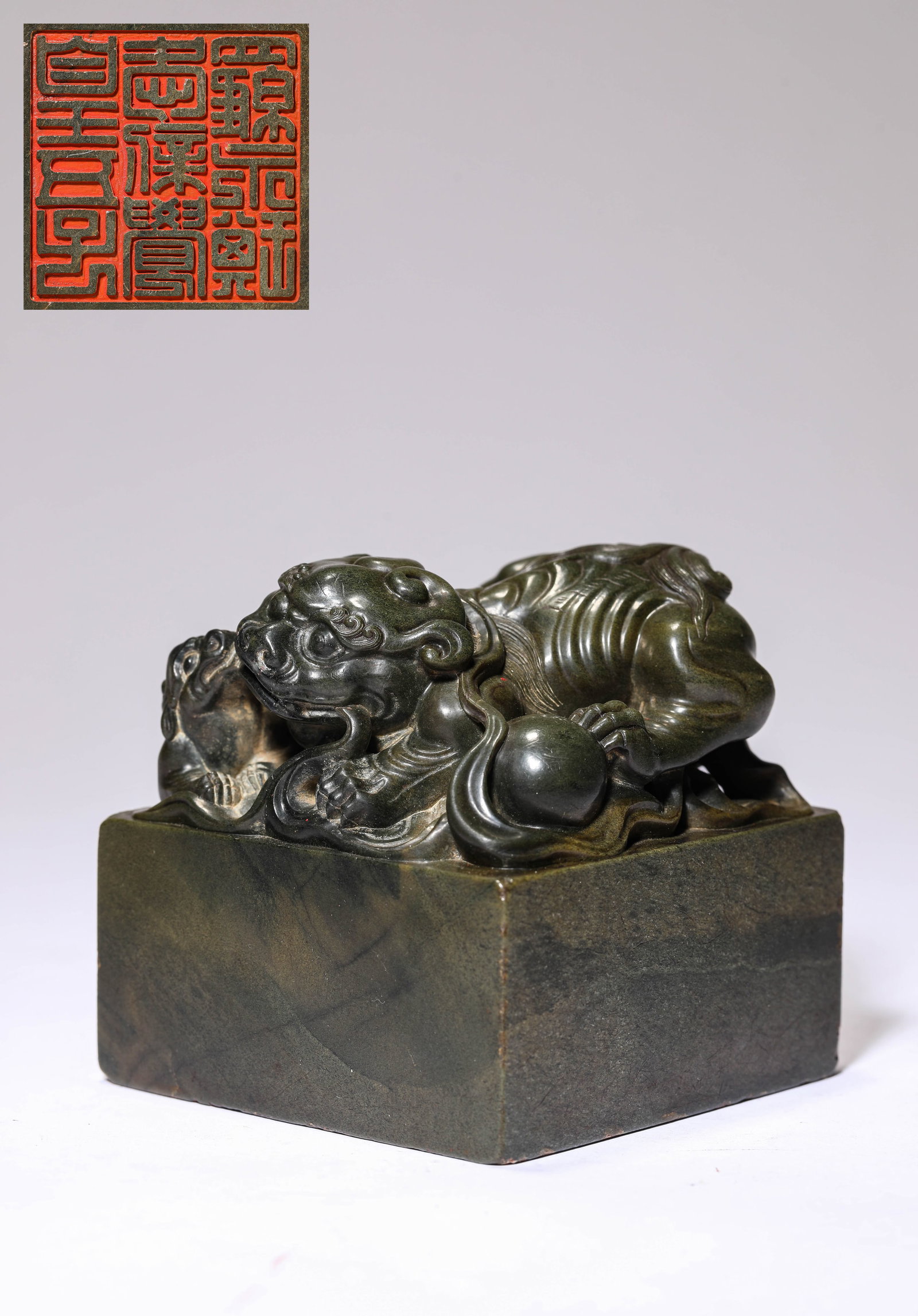 A 'LION AND CUB-FORM FINIAL' SEAL: A 'LION AND CUB-FORM FINIAL' SEAL Dimensions: Width: 8.2 cm (3.23 in) x Height: 8.5 cm (3.35 in). All measurements are approximate.