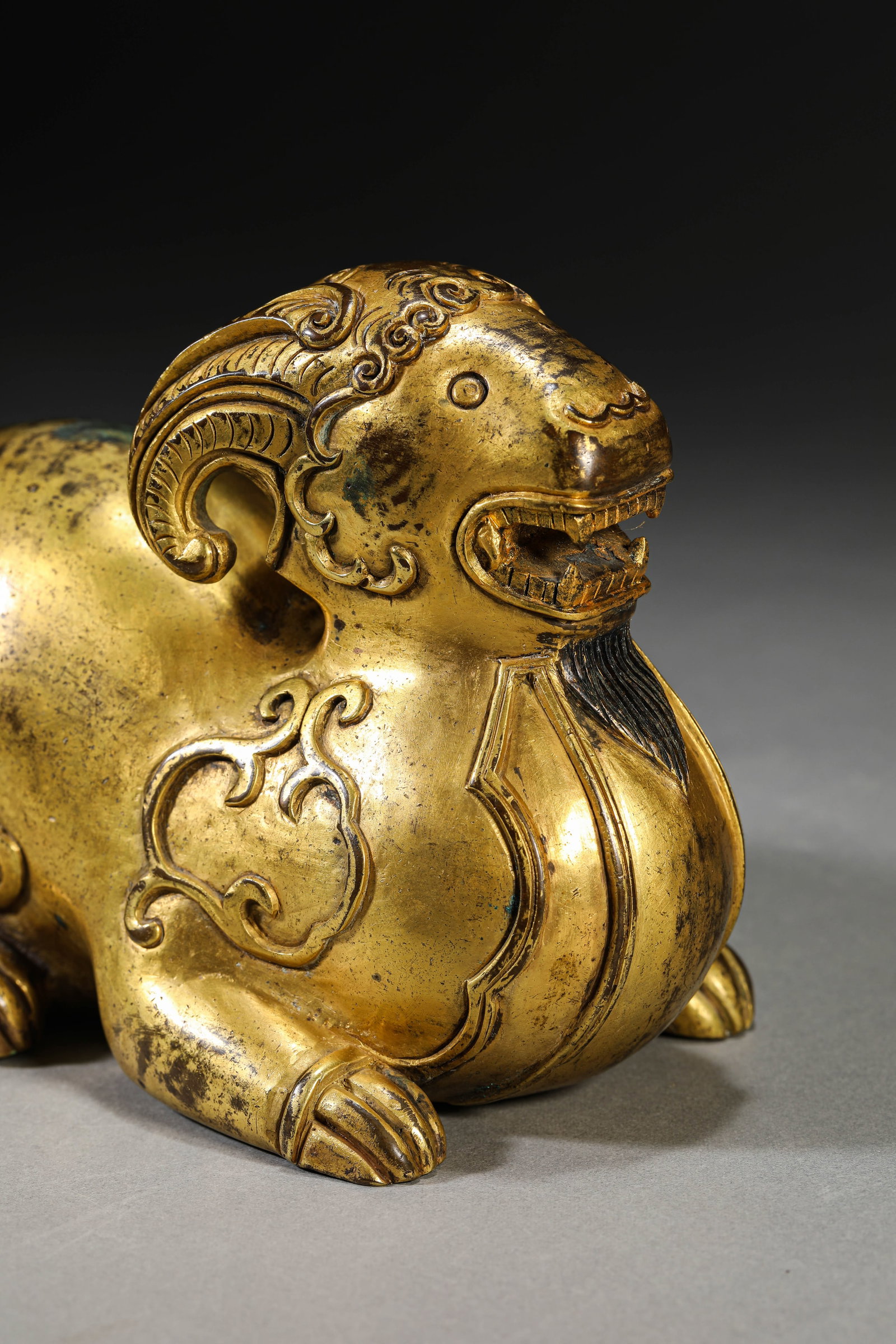 A GILT-BRONZE RAM - 4