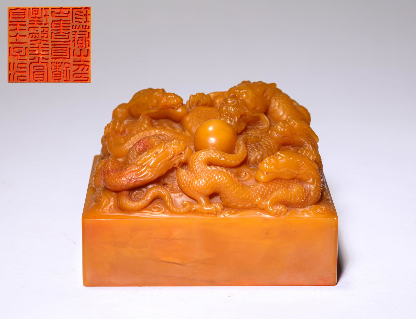 A TIANHUANG STONE 'DRAGON-FORM FINIAL' SEAL: A TIANHUANG STONE 'DRAGON-FORM FINIAL' SEAL Dimensions: Length: 10.5 cm (4.13 in) x Width: 9.5 cm (3.74 in) x Height: 7.0 cm (2.76 in). All measurements are approximate.