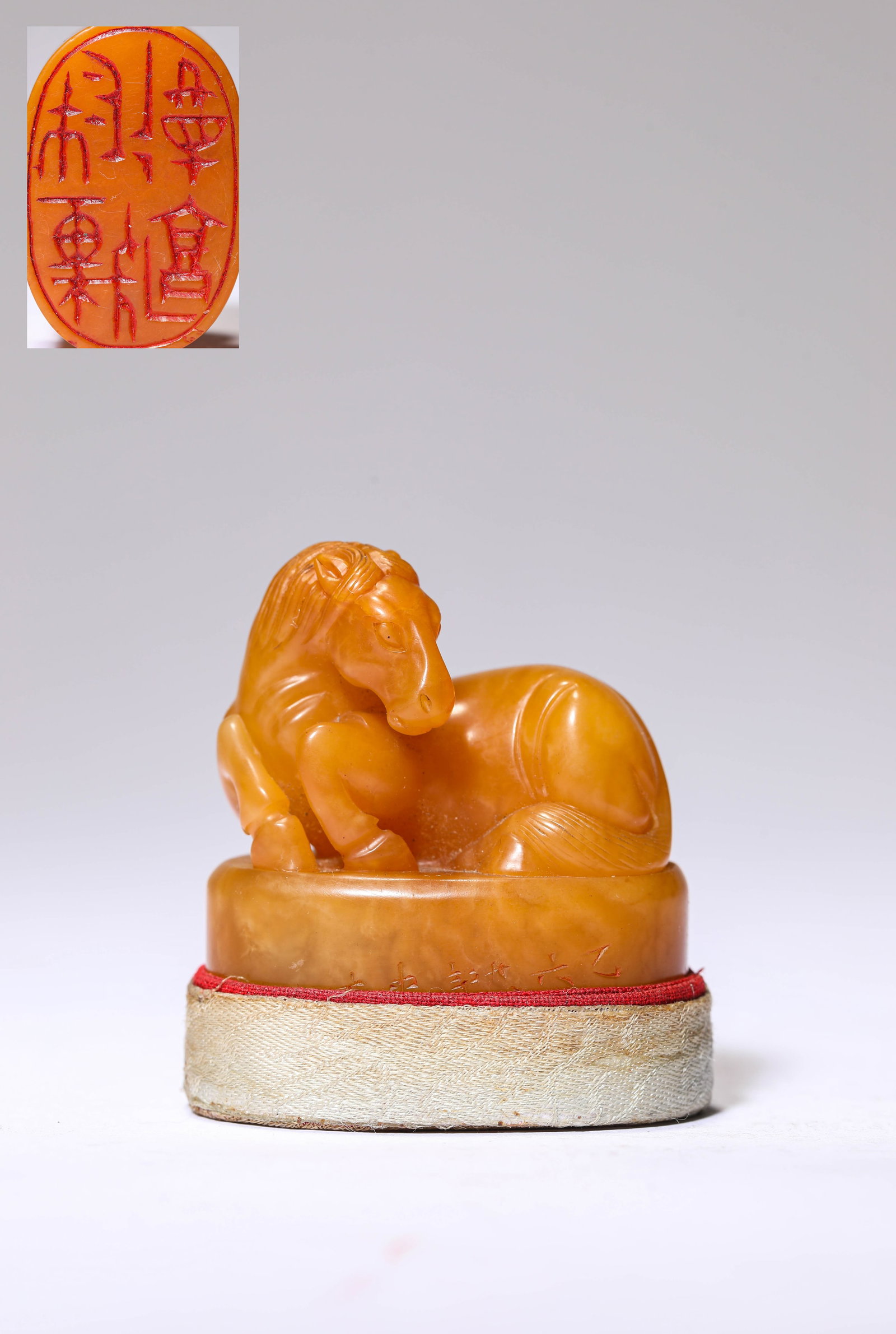 A TIANHUANG STONE 'RECUMBENT HORSE-FORM FINIAL' SEAL: A TIANHUANG STONE 'RECUMBENT HORSE-FORM FINIAL' SEAL Dimensions: Length: 4.6 cm (1.81 in) x Width: 3.1 cm (1.22 in) x Height: 5.3 cm (2.09 in). All measurements are approximate.