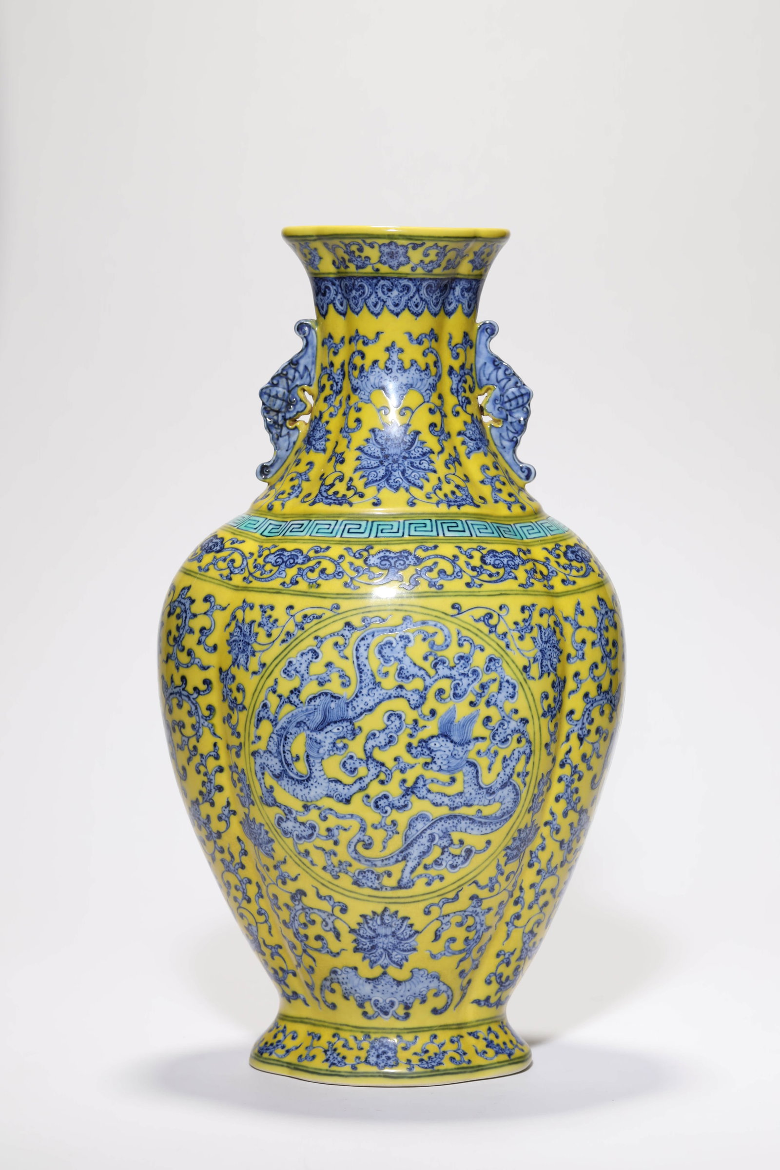 A YELLOW-GROUND BLUE AND WHITE 'DRAGON RESERVES' VASE (1 of 5)