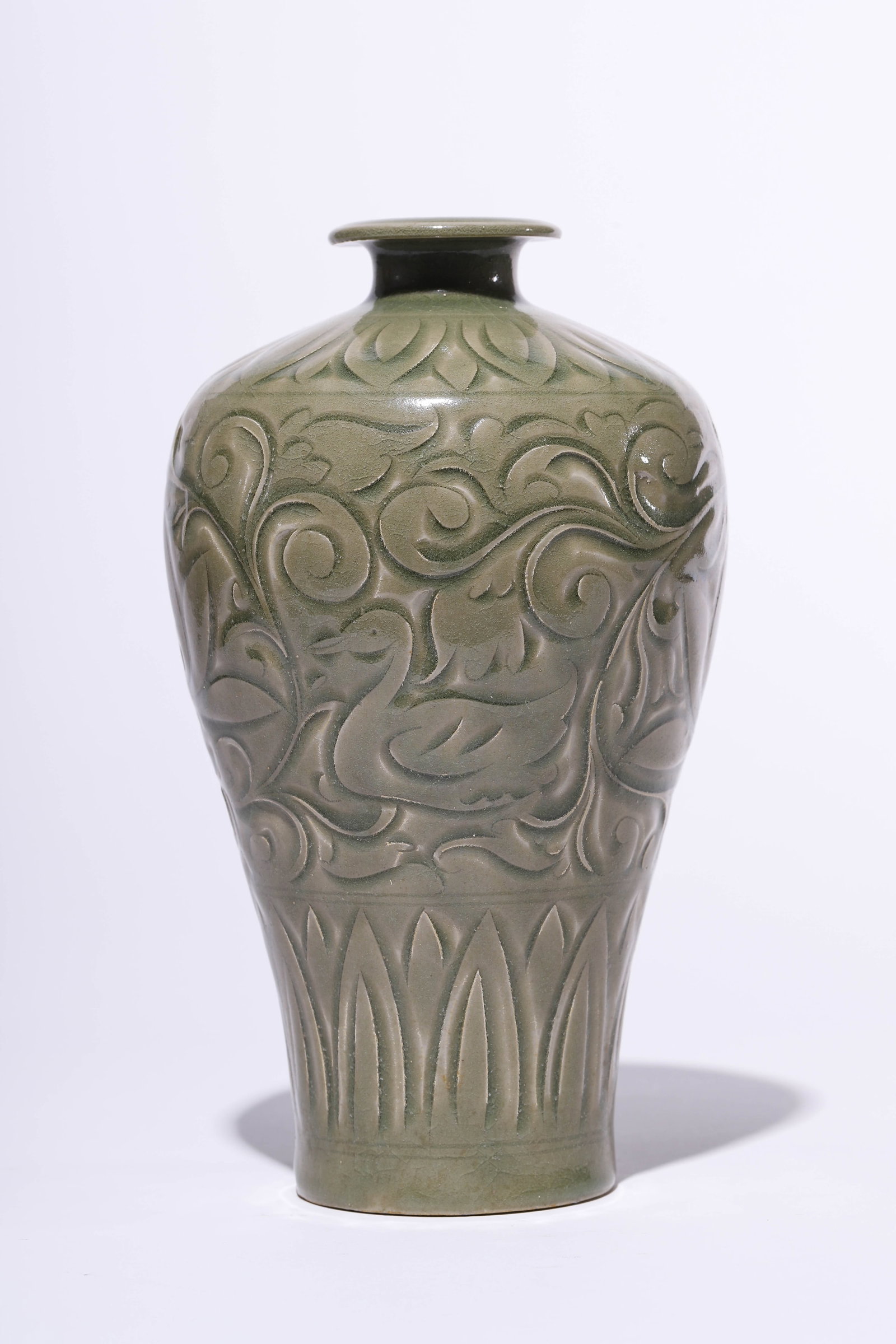 A YAOZHOU-TYPE 'CARVED FLORAL' MEIPING: A YAOZHOU-TYPE 'CARVED FLORAL' MEIPING Dimensions: Width: 13.5 cm (5.31 in) x Height: 23.5 cm (9.25 in). All measurements are approximate.