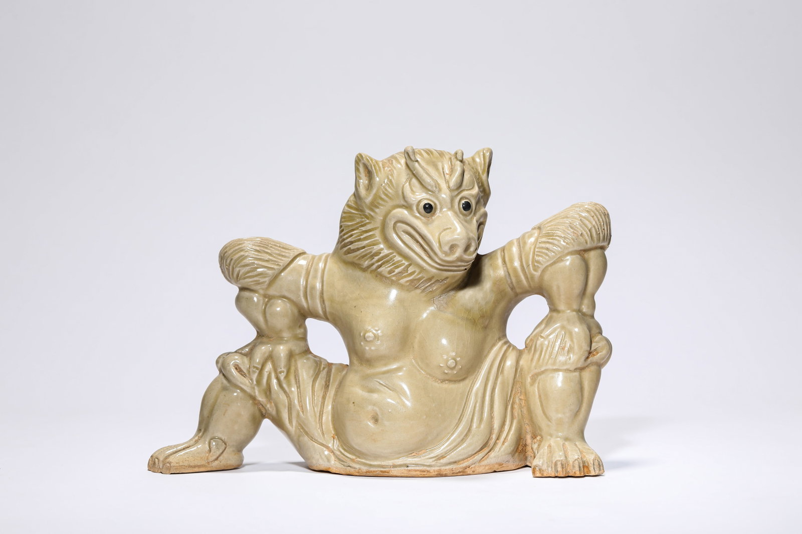 A PORCELAIN 'AUSPICIOUS BEAST': A PORCELAIN 'AUSPICIOUS BEAST' Dimensions: Length: 21.2 cm (8.35 in) x Width: 8.4 cm (3.31 in) x Height: 15.0 cm (5.91 in). All measurements are approximate.
