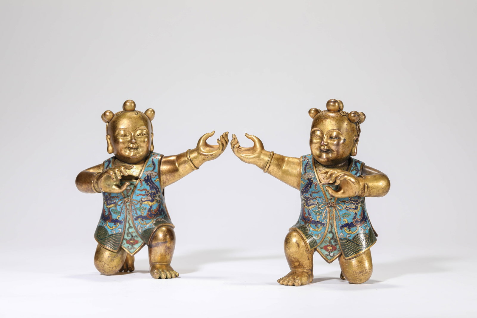A GROUP OF CLOISONNé ENAMEL 'BOYS': A GROUP OF CLOISONNé ENAMEL 'BOYS' Dimensions: Weight: 576g. Length: 11.7 cm (4.61 in) x Width: 7.7 cm (3.03 in) x Height: 13.0 cm (5.12 in). All measurements are approximate.
