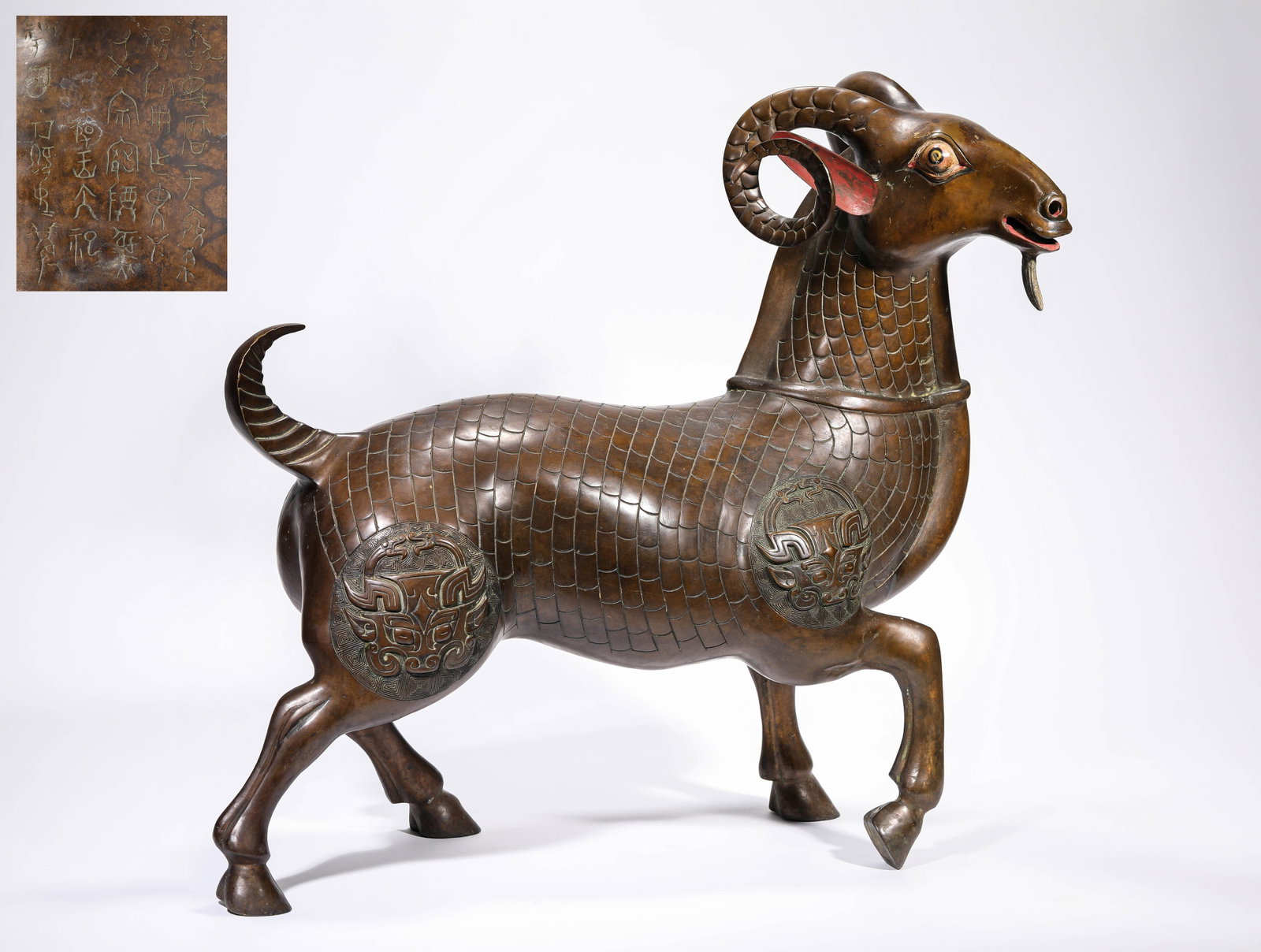 AN ALLOY BRONZE 'VOTIVE' RAM: AN ALLOY BRONZE 'VOTIVE' RAM Dimensions: Weight: 11.3kg. Length: 57.0 cm (22.44 in) x Width: 20.8 cm (8.19 in) x Height: 51.5 cm (20.28 in). All measurements are approximate.