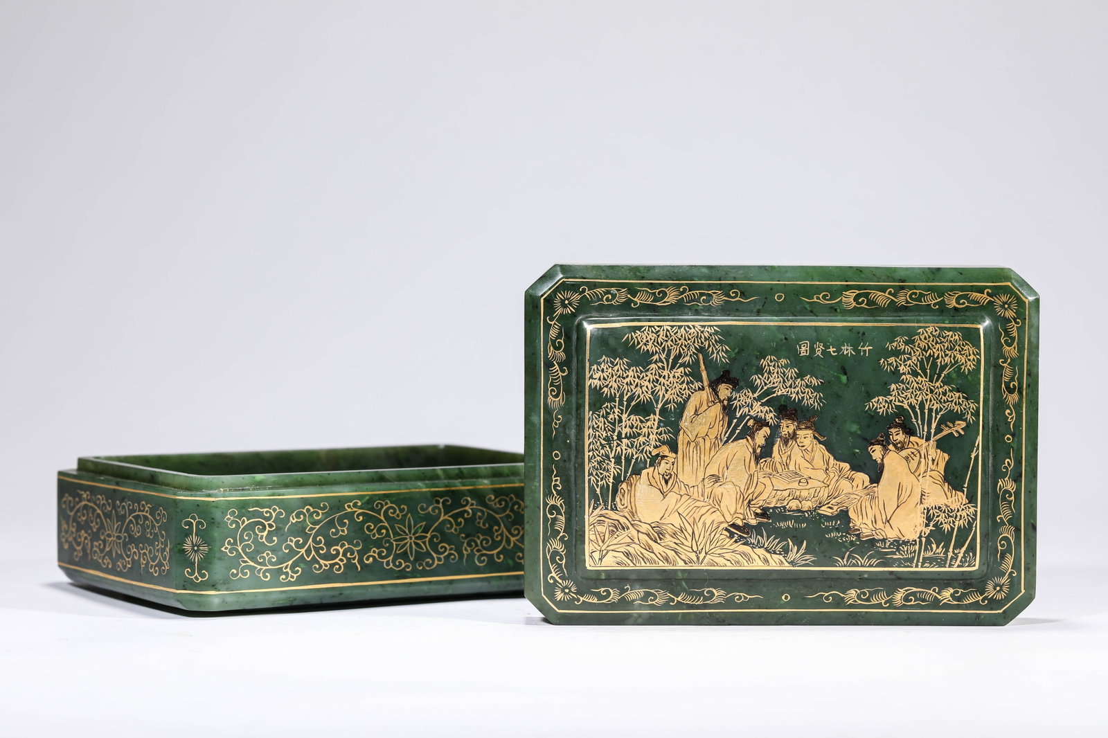A SPINACH JADE GILT-DECORATED COVERED BOX: A SPINACH JADE GILT-DECORATED COVERED BOX Dimensions: Length: 16.3 cm (6.42 in) x Width: 11.4 cm (4.49 in) x Height: 7.0 cm (2.76 in). All measurements are approximate.