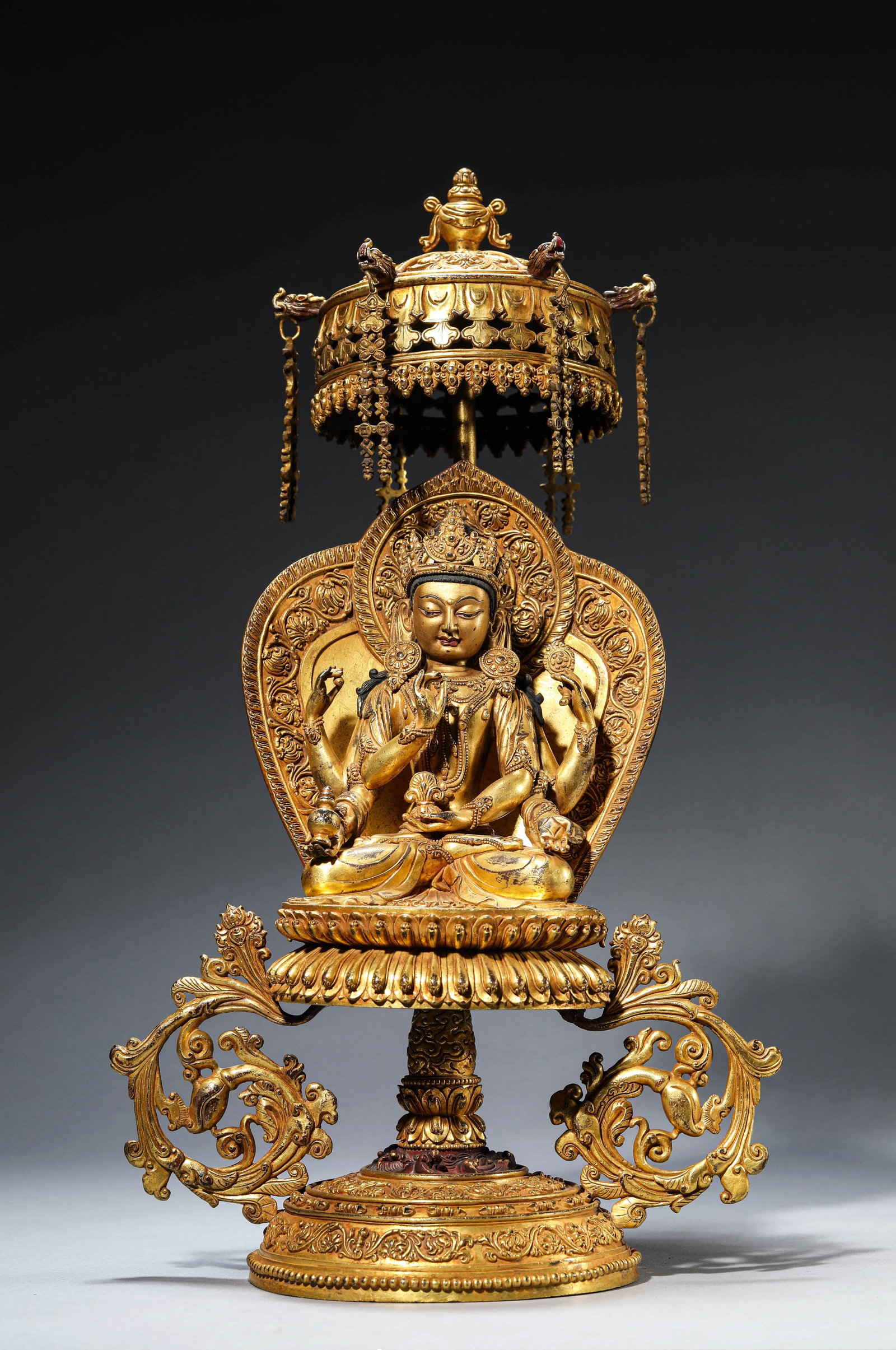 A GILT-BRONZE FIGURE OF SIX-ARMED AVALOKITESHVARA: A GILT-BRONZE FIGURE OF SIX-ARMED AVALOKITESHVARA Dimensions: Weight: 6.9kg. Length: 27.5 cm (10.83 in) x Width: 16.5 cm (6.50 in) x Height: 49.0 cm (19.29 in). All measurements are approximate.