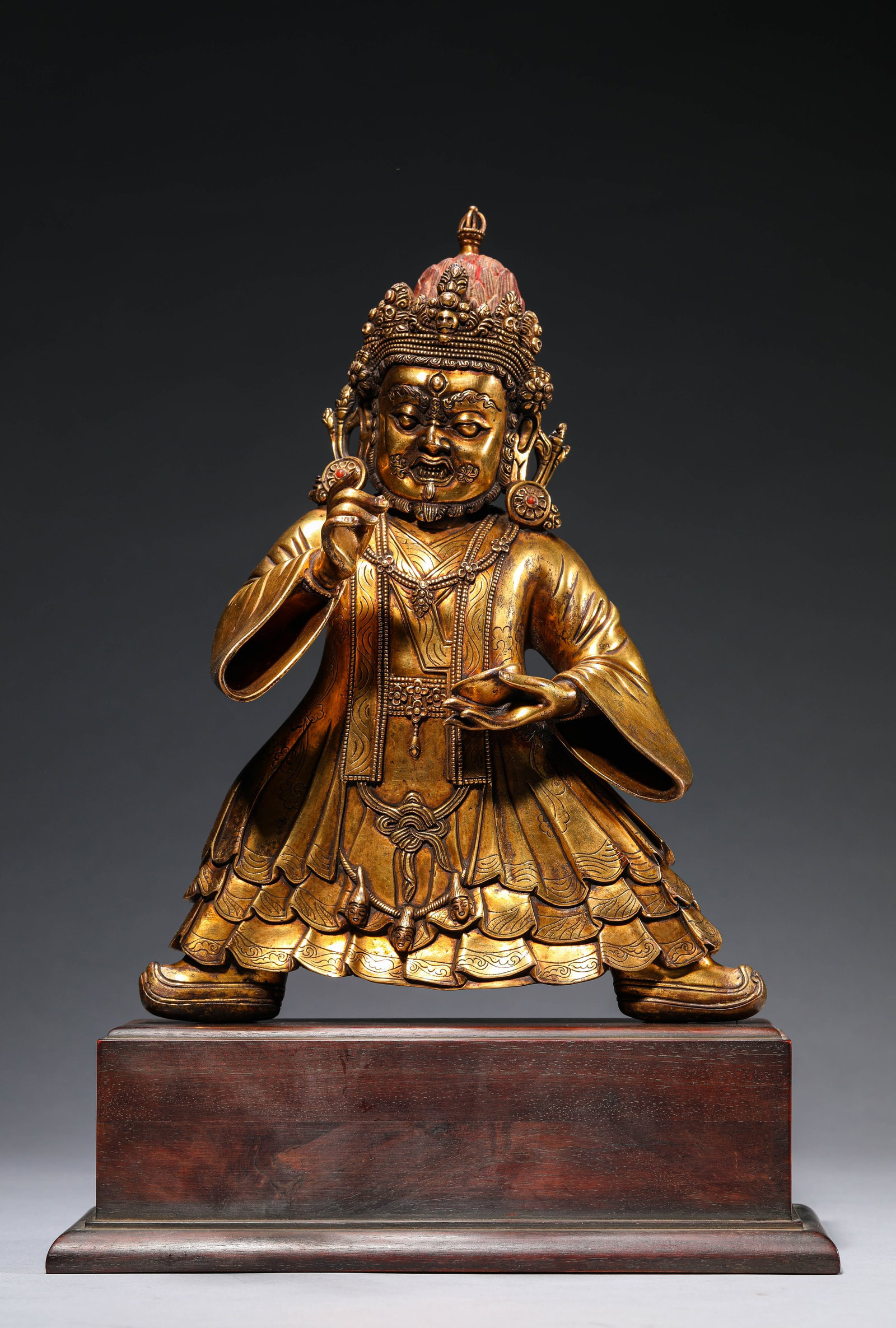 A GILT-BRONZE FIGURE OF MAHAKALA: A GILT-BRONZE FIGURE OF MAHAKALA Dimensions: Weight: 3.75kg. Length: 26.0 cm (10.24 in) x Width: 10.5 cm (4.13 in) x Height: 36.0 cm (14.17 in). All measurements are approximate.