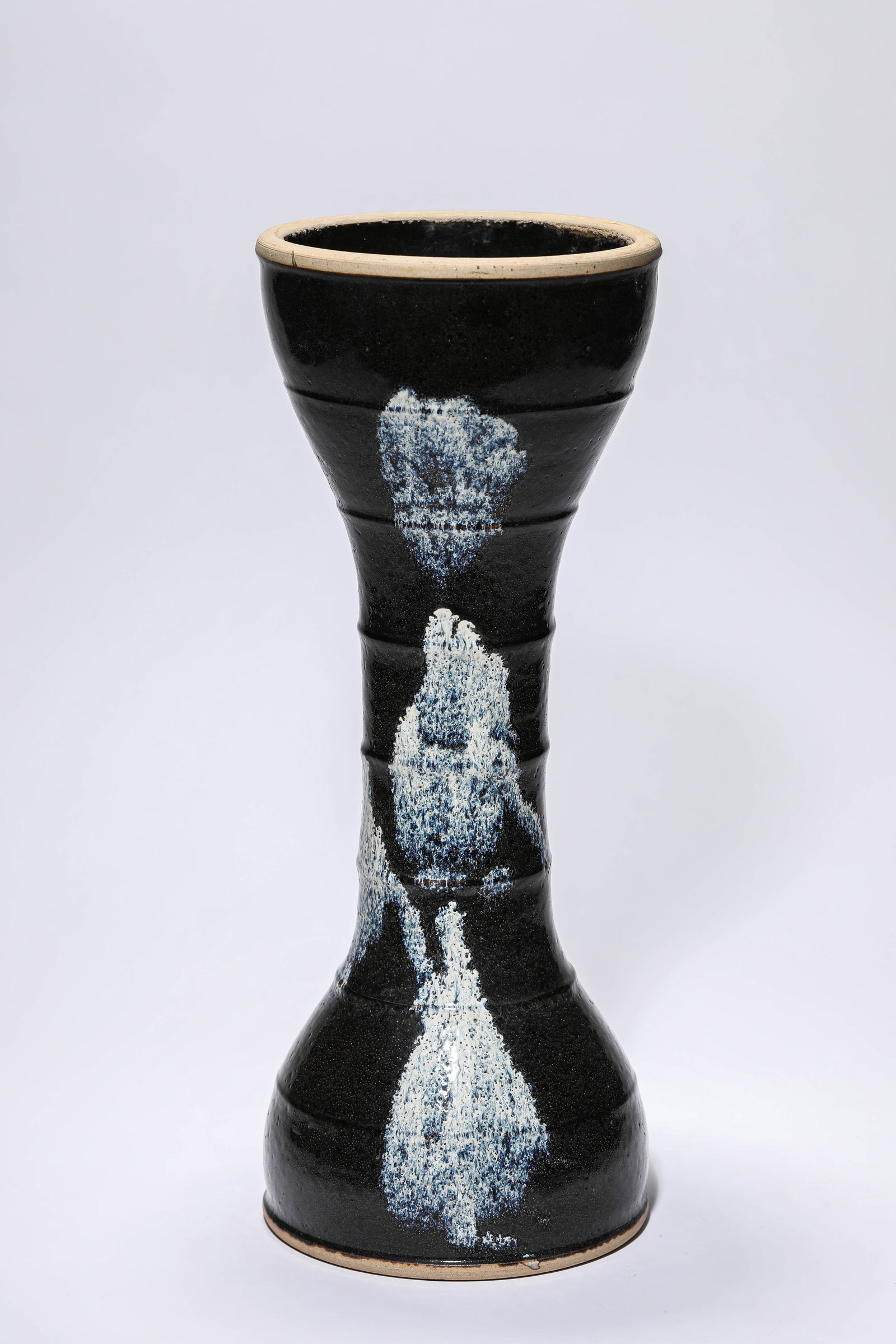 A BLACK-GLAZED 'DRUM-FORM' VASE: A BLACK-GLAZED 'DRUM-FORM' VASE Dimensions: Width: 15.5 cm (6.10 in) x Height: 40.5 cm (15.94 in). All measurements are approximate.