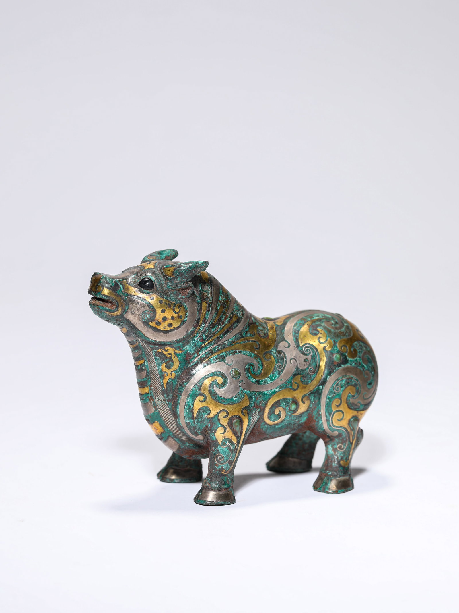 A GOLD AND SILVER-INLAID BRONZE OX (1 of 6)
