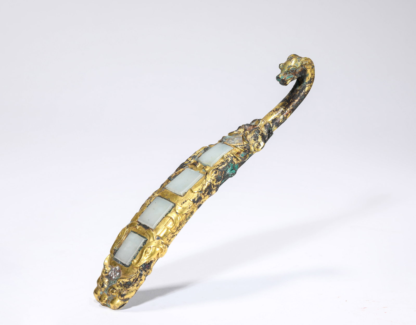 A GILT-BRONZE AND JADE-INLAID BELT HOOK (1 of 7)