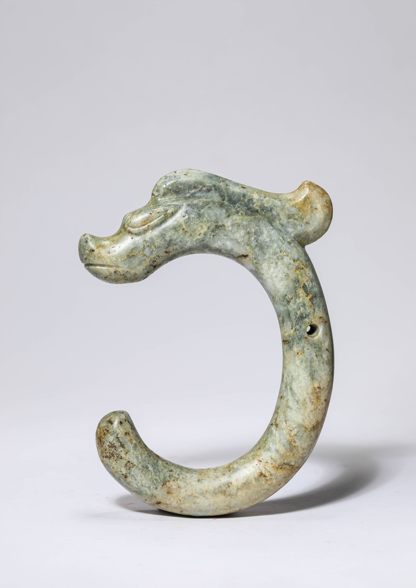A JADE DRAGON: A JADE DRAGON Dimensions: Width: 10.5 cm (4.13 in) x Height: 14.0 cm (5.51 in). All measurements are approximate.