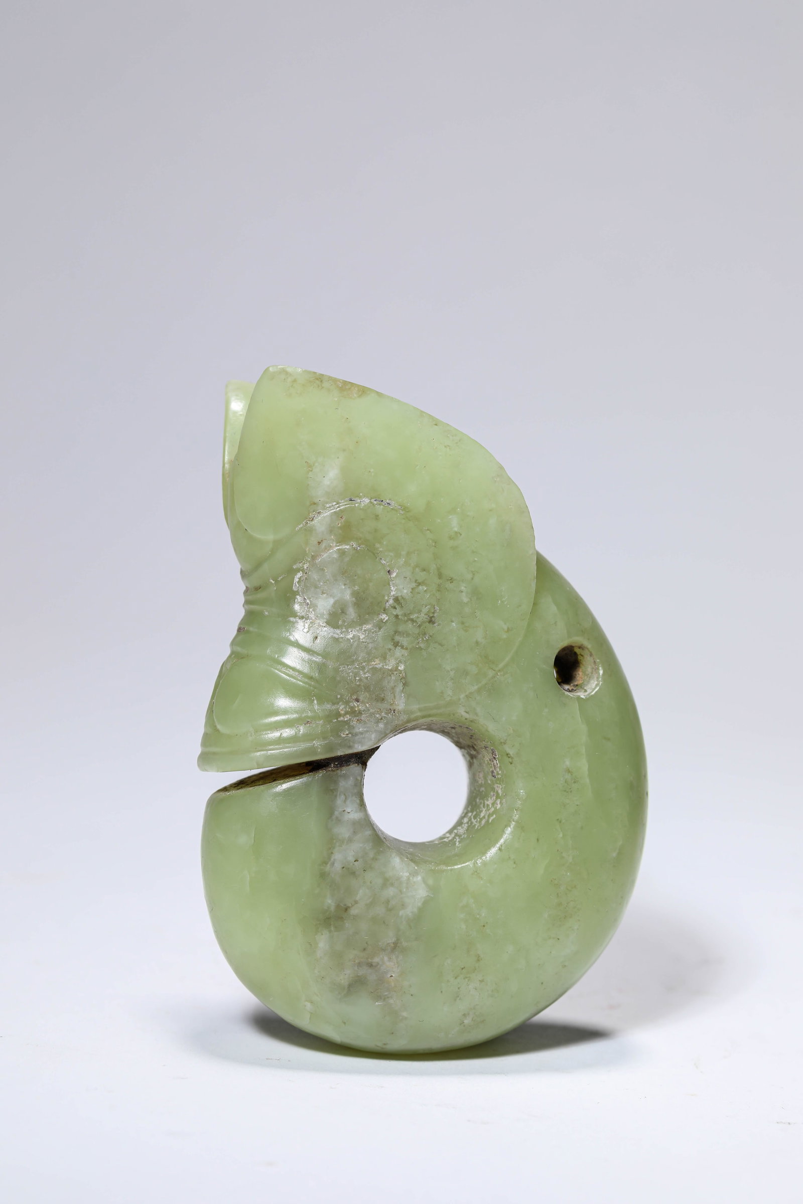 A JADE 'PIG-DRAGON': A JADE 'PIG-DRAGON' Dimensions: Width: 7.0 cm (2.76 in) x Height: 10.5 cm (4.13 in). All measurements are approximate.