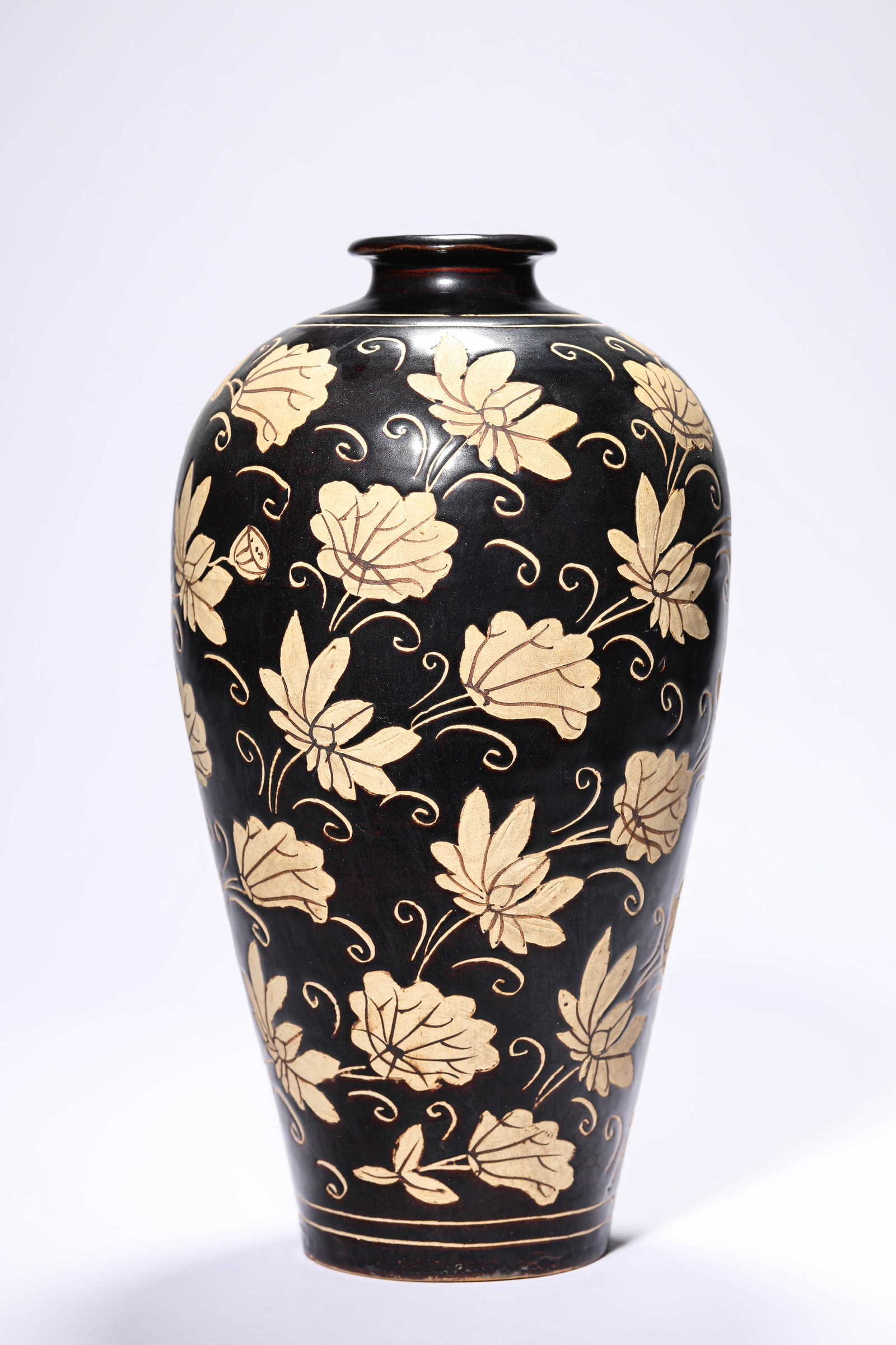 A CIZHOU-TYPE 'CARVED FLORAL' MEIPING: A CIZHOU-TYPE 'CARVED FLORAL' MEIPING Dimensions: Width: 16.7 cm (6.57 in) x Height: 31.4 cm (12.36 in). All measurements are approximate.