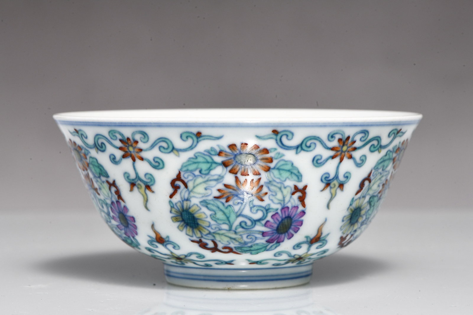 CELADON-GLAZED BOWL WITH CLUSTERED CHRYSANTHEMUMS PATTERN, MADE IN THE YEAR OF THE QIANLONG REIGN OF: CELADON-GLAZED BOWL WITH CLUSTERED CHRYSANTHEMUMS PATTERN, MADE IN THE YEAR OF THE QIANLONG REIGN OF THE QING DYNASTY Description: Width: 11.5 cm Height: 5 cm