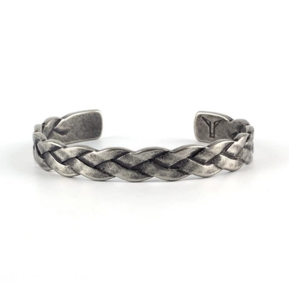 BRAIDED SILVER-TONE BRACELET: BRAIDED SILVER-TONE BRACELET Description: A braided silver-tone bracelet with a woven or twisted construction. The catalogue should note clasp condition, metal marks, length, flexibility and areas of