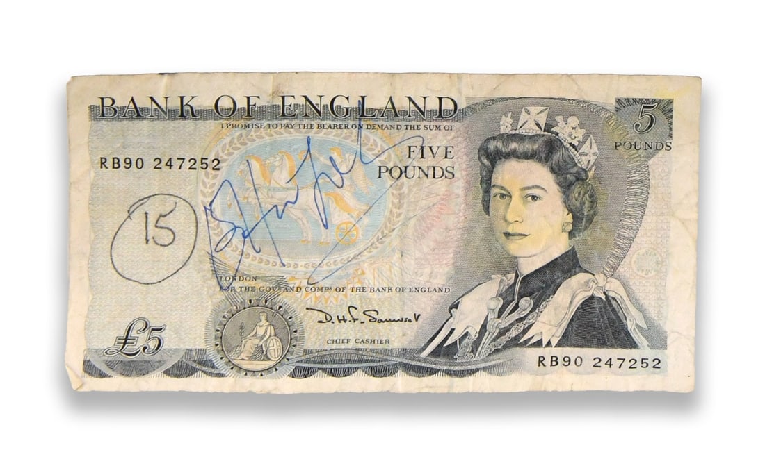 ELTON JOHN (B. 1947), SIGNED BANK OF ENGLAND FIVE POUND NOTE: ELTON JOHN (B. 1947), SIGNED BANK OF ENGLAND FIVE POUND NOTE Provenance and Authenticity: Elton John (b. 1947), Signed Bank of England Five Pound Note is presented as a signed book or publication