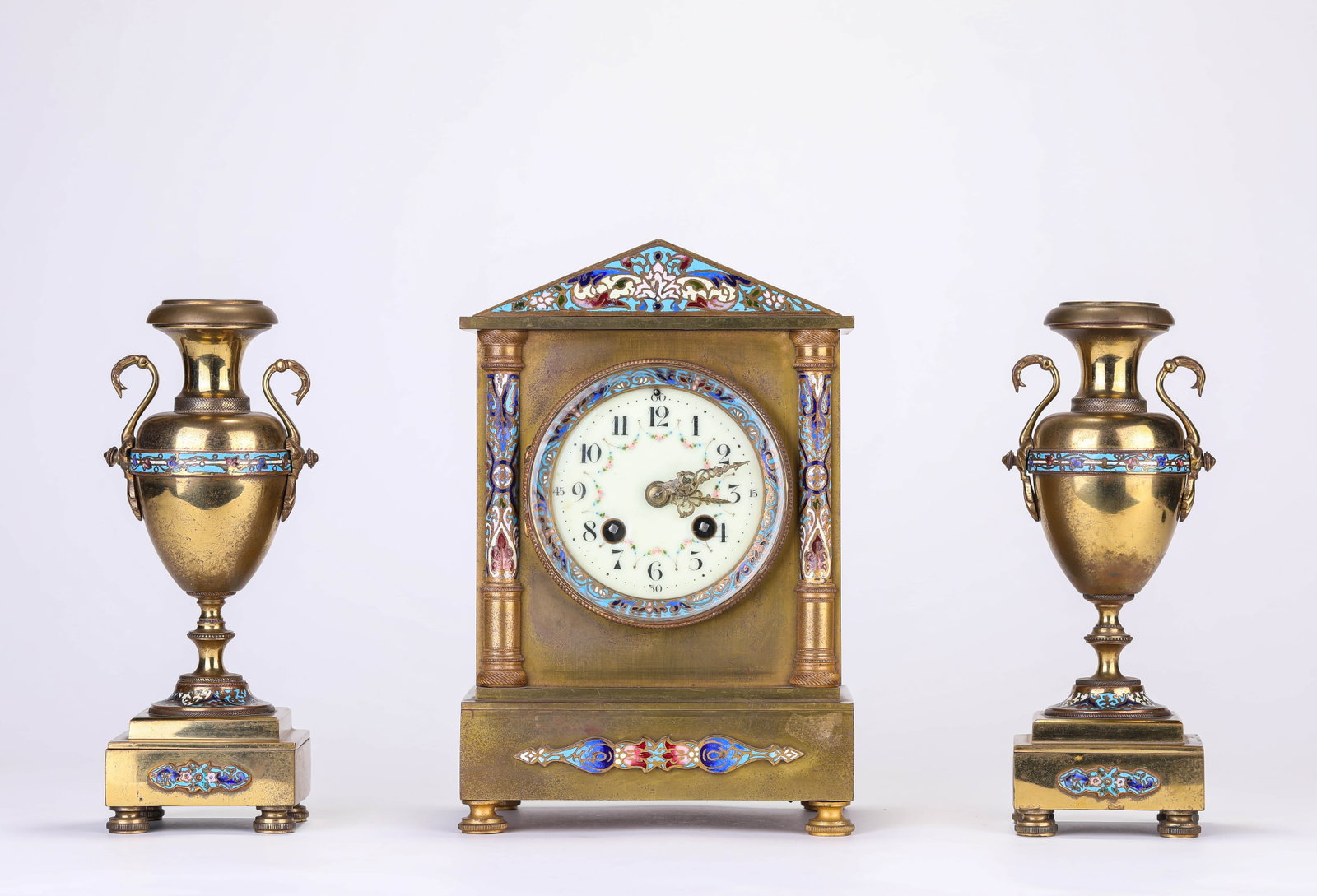 A FRENCH GILT-BRONZE AND ENAMEL MANTEL CLOCK: A FRENCH GILT-BRONZE AND ENAMEL MANTEL CLOCK Description: Dimensions: Weight: 5361 g. Length: 16.4 cm x Width: 11.8 cm x Height: 24.8 cm. Weight: 1386 g. Length: 8 cm x Width: 7 cm x Height: 22.4 cm.