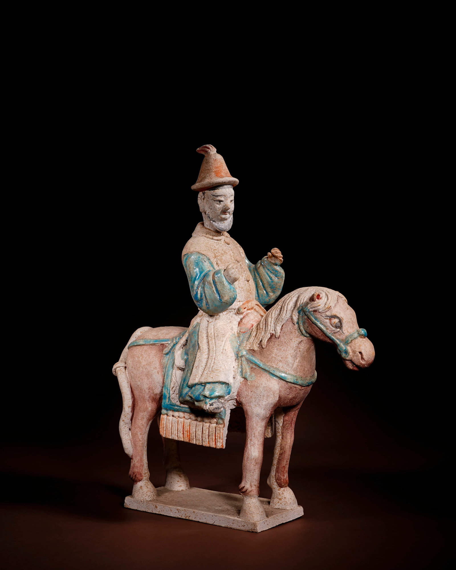 A PAINTED POTTERY 'OFFICIAL IN BLUE ROBE WITH DETACHABLE HEAD' HORSE AND ATTENDANT (1 of 4)