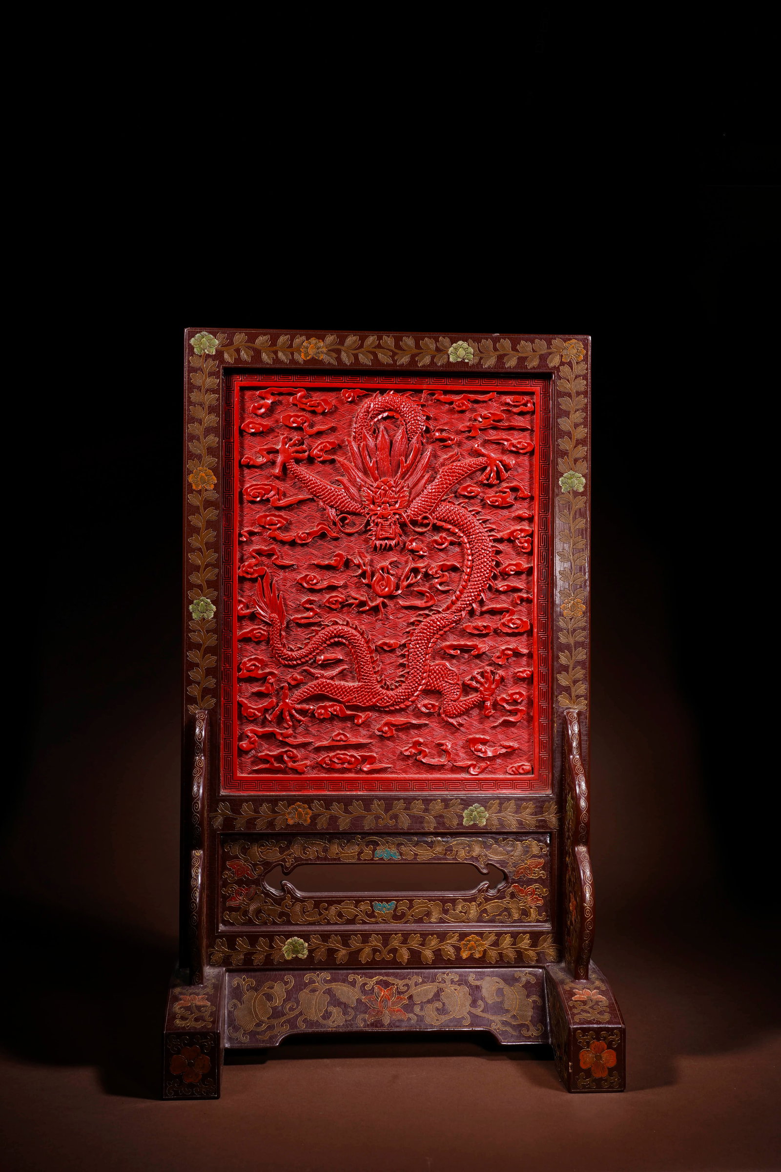 A CARVED CINNABAR LACQUER 'DRAGON' TABLE SCREEN (1 of 4)