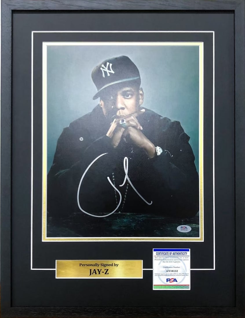 JAY-Z AUTOGRAPHED PORTRAIT PHOTOGRAPH, ACCOMPANIED BY A PSA CERTIFICATE: JAY-Z AUTOGRAPHED PORTRAIT PHOTOGRAPH, ACCOMPANIED BY A PSA CERTIFICATE Length: 68 cm (26.8 in.), Width: 64 cm (25.2 in.). All measurements are approximate.