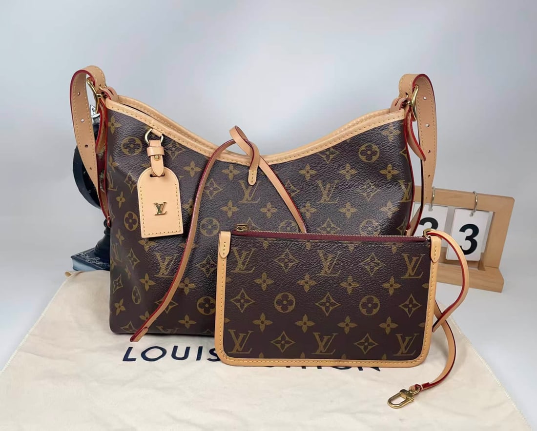 LOUIS VUITTON CARRYALL SMALL TOTE BAG: LOUIS VUITTON CARRYALL SMALL TOTE BAG Louis Vuitton CarryAll PM Tote Bag. Crafted from classic Monogram coated canvas with natural cowhide leather trim. Featuring a magnetic closure, multiple