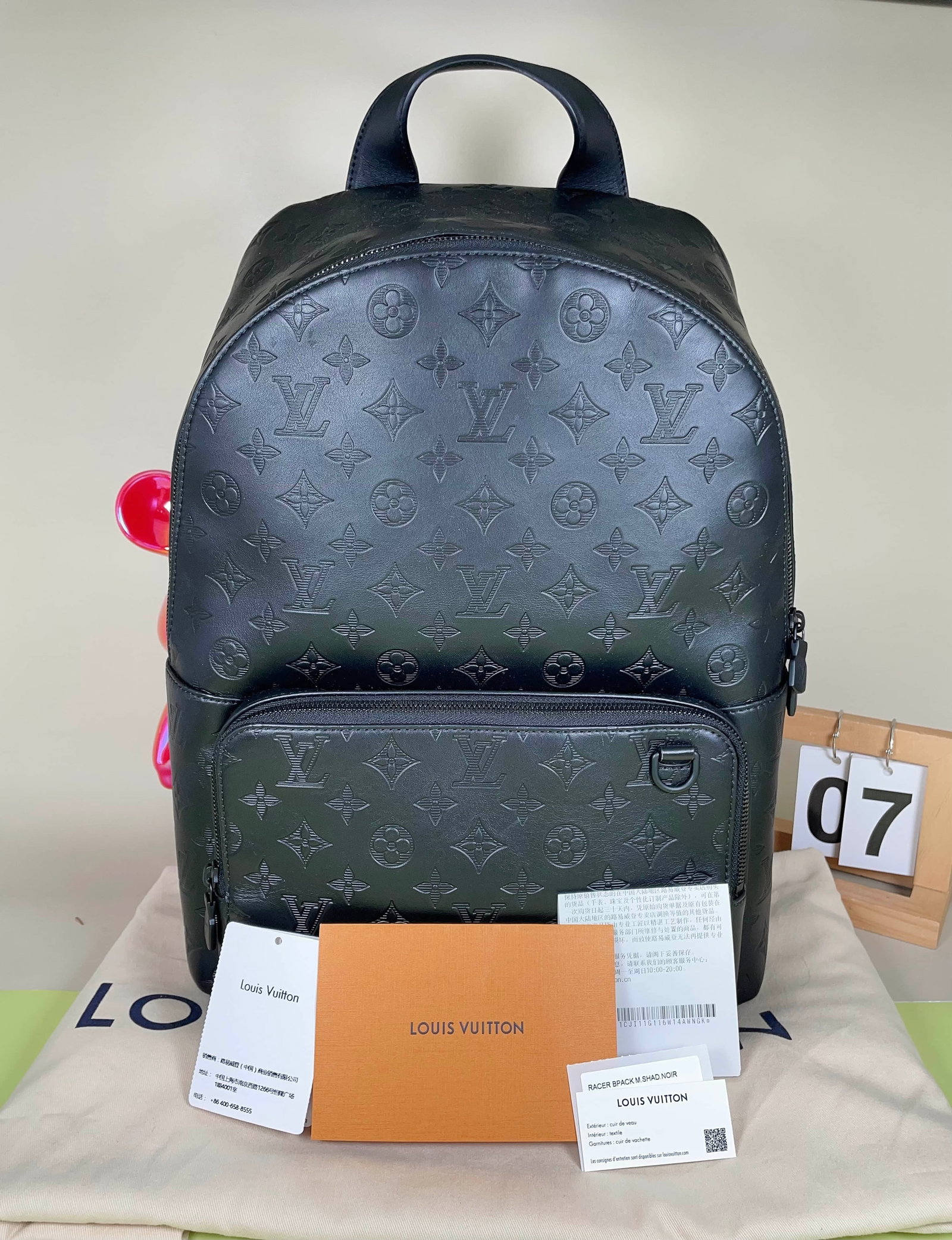 LOUIS VUITTON BLACK EMBOSSED MONOGRAM BACKPACK: LOUIS VUITTON BLACK EMBOSSED MONOGRAM BACKPACK LOUIS VUITTON. A black embossed Monogram leather backpack with multiple interior compartments and adjustable shoulder straps. Unused condition.