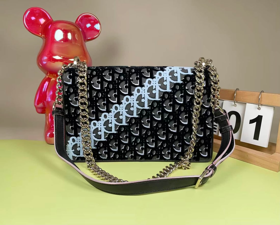 DIOR OBLIQUE CHAIN SHOULDER BAG: DIOR OBLIQUE CHAIN SHOULDER BAG DIOR. A chain shoulder bag featuring the House's signature Oblique pattern, a softly textured exterior, metal clasp closure and chain strap. Dimensions: 25.5 × 16 ×