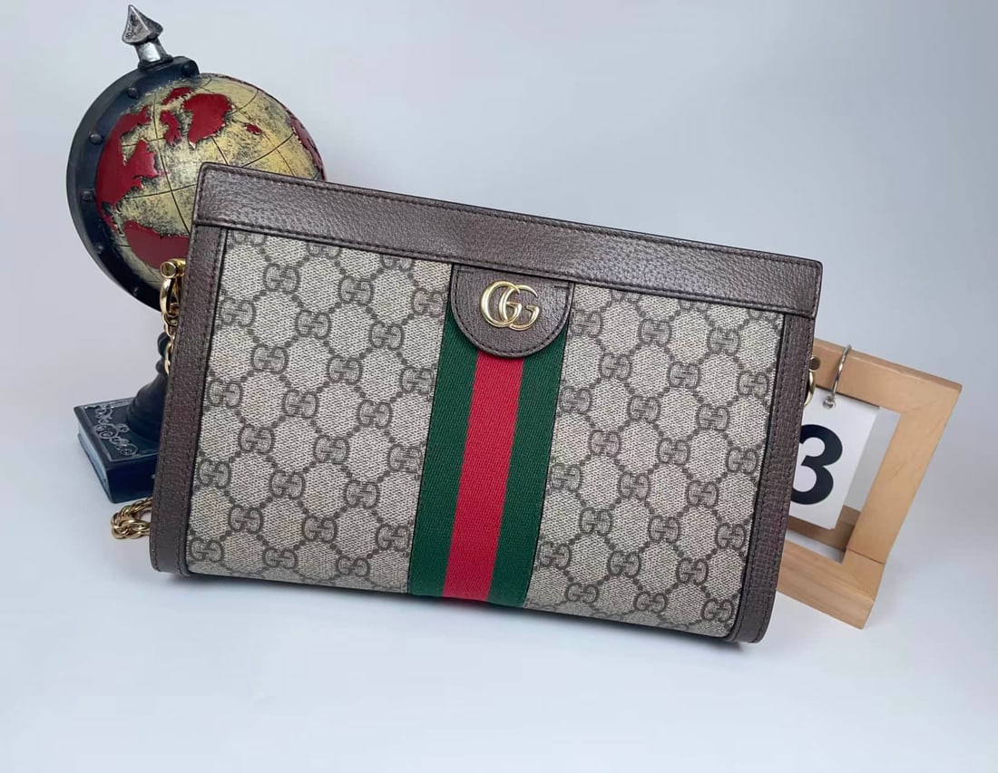 GUCCI OPHIDIA SMALL CHAIN CROSSBODY BAG: GUCCI OPHIDIA SMALL CHAIN CROSSBODY BAG GUCCI, Ophidia. A small chain shoulder and crossbody bag crafted from GG Supreme canvas with red-and-green Web detailing, brown leather trim, Double G hardware