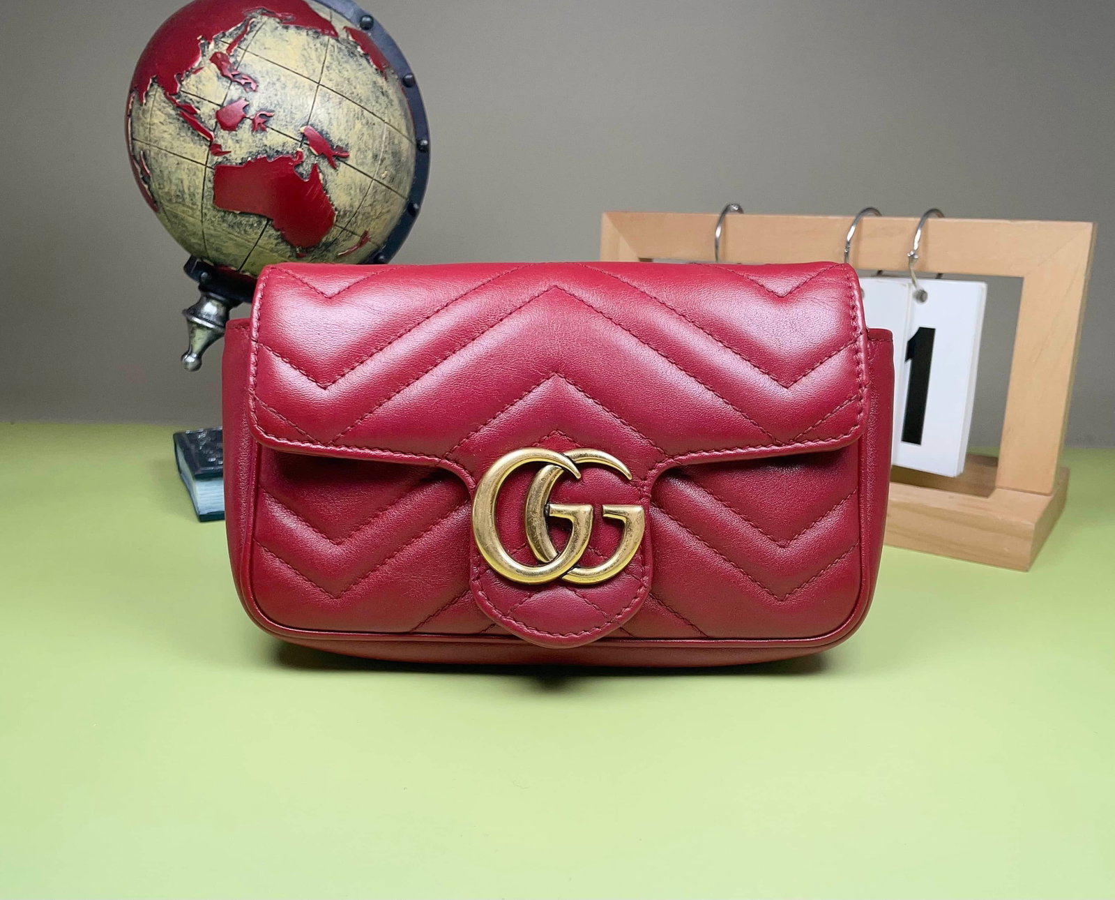 GUCCI GG MARMONT BAG: GUCCI GG MARMONT BAG GUCCI, GG Marmont. A compact quilted bag applied with the House's Double G hardware. Dimensions: 17 × 10 × 4.5 cm.
