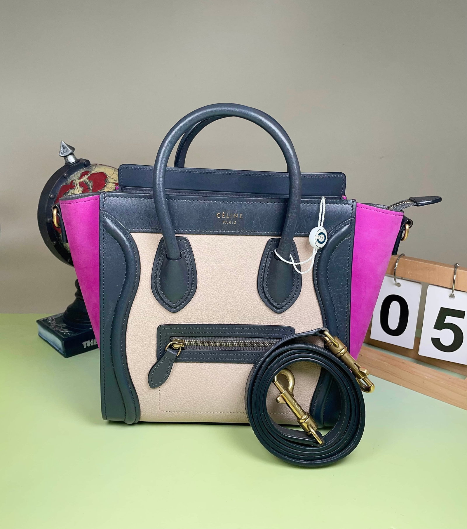 CELINE LUGGAGE MICRO HANDBAG: CELINE LUGGAGE MICRO HANDBAG CELINE, Luggage Micro. A colour-block handbag combining light taupe grained calfskin, dark grey leather and rose-pink suede. Featuring the model's signature curved front