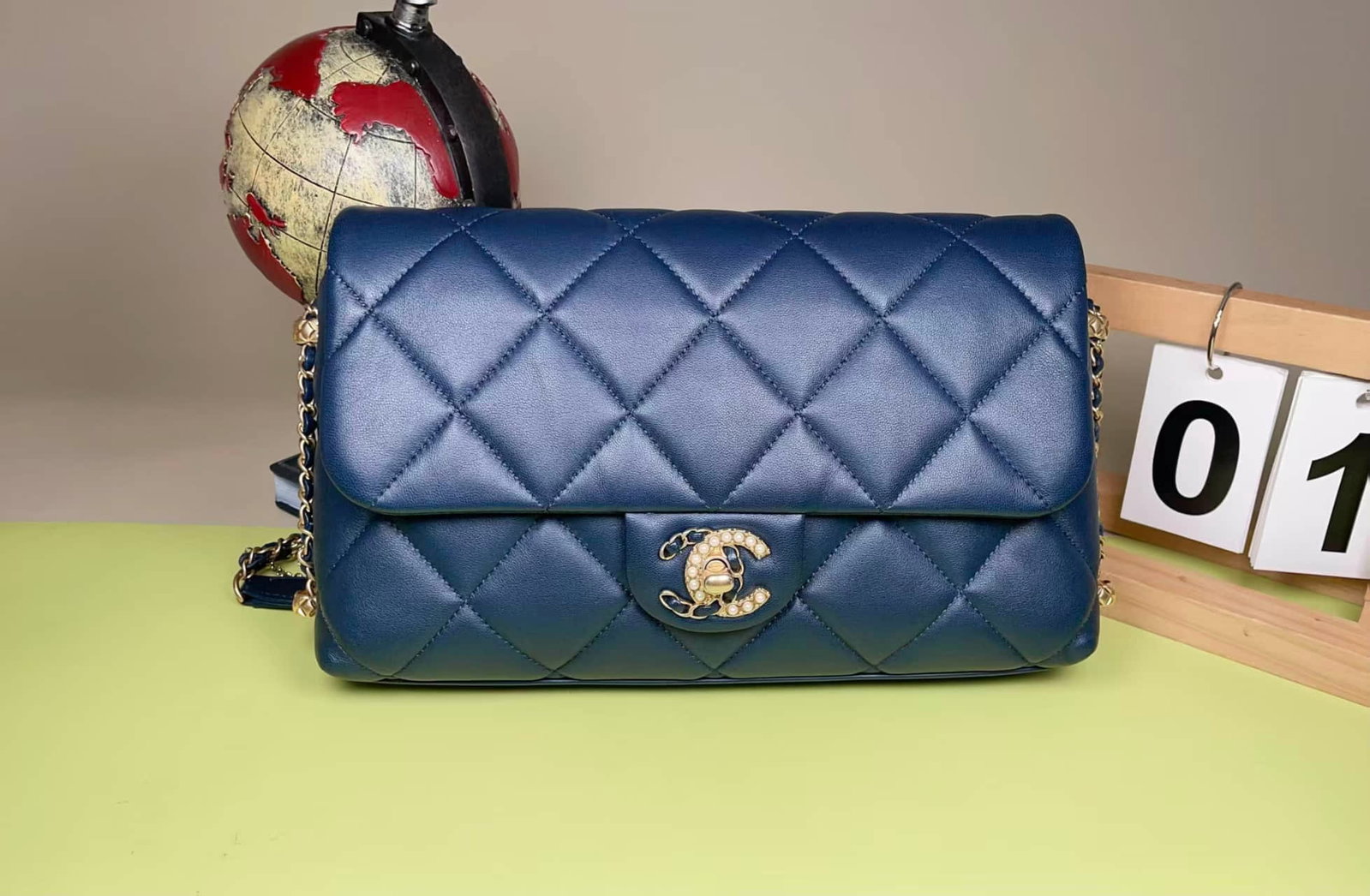 CHANEL PEARL-CLASP LAMBSKIN FLAP CROSSBODY BAG: CHANEL PEARL-CLASP LAMBSKIN FLAP CROSSBODY BAG CHANEL. A lambskin flap crossbody bag featuring contrasting black-and-white pearl-set clasp details. A microchip-era example, presented in excellent cond