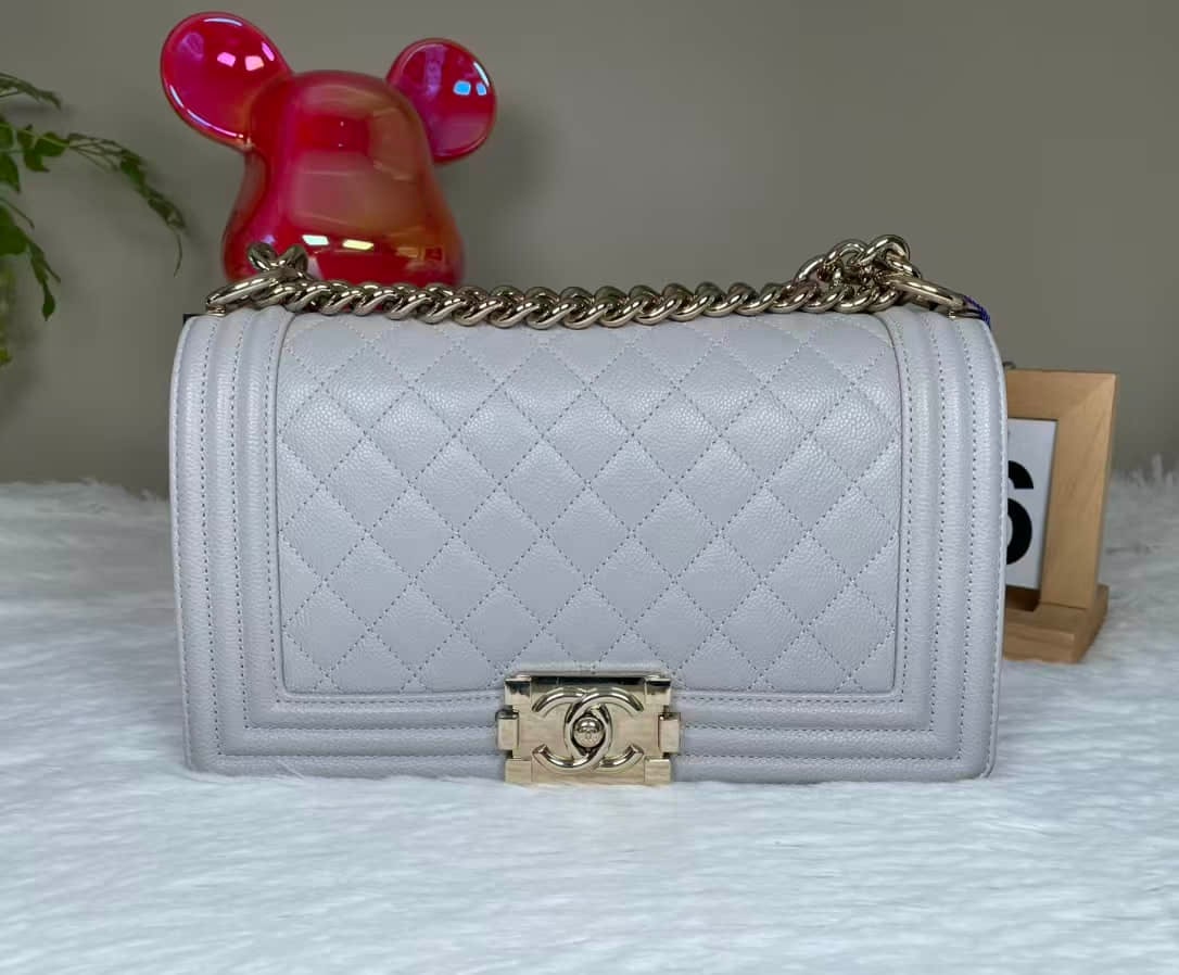 CHANEL MEDIUM GRAINED CALFSKIN FLAP BAG: CHANEL MEDIUM GRAINED CALFSKIN FLAP BAG CHANEL. A medium flap shoulder bag crafted from platinum-grey grained calfskin and finished with gold-tone hardware. A microchip-era example designed for