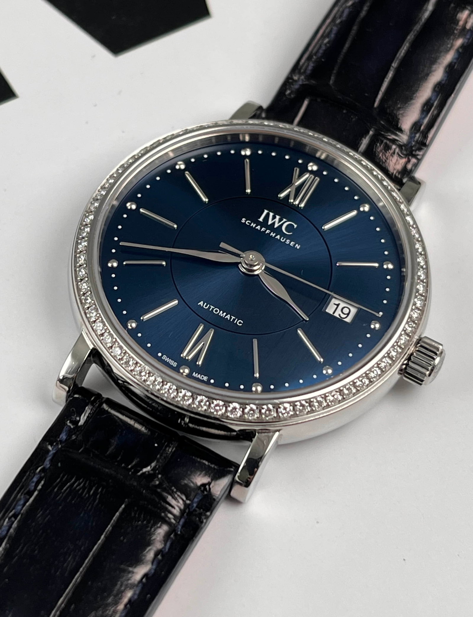 IWC PORTOFINO AUTOMATIC WRISTWATCH, REF. IW458111: IWC PORTOFINO AUTOMATIC WRISTWATCH, REF. IW458111 IWC, Portofino, Ref. IW458111. A 37 mm stainless-steel automatic wristwatch with a diamond-set bezel and deep-blue sunburst dial. The movement